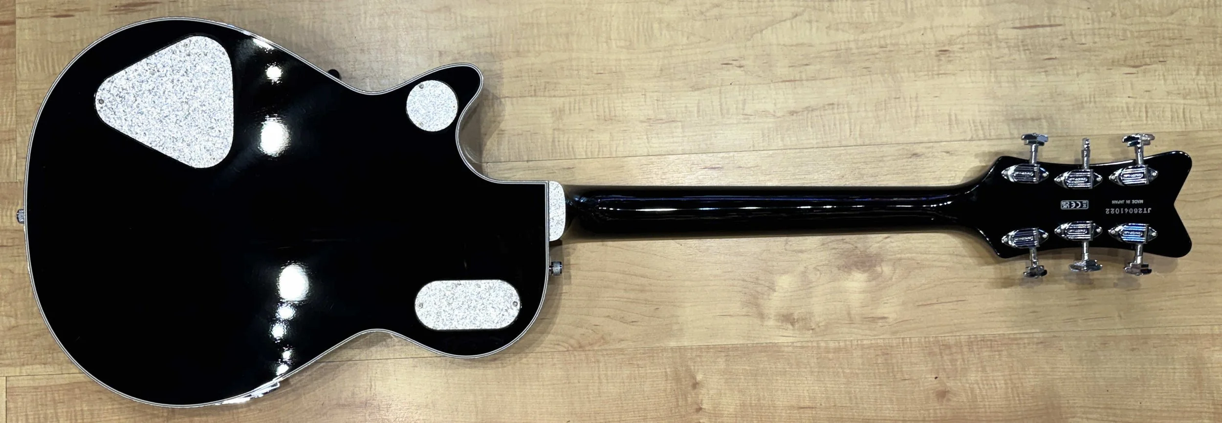 Back of The Gretsch G6134T-58 Limited Edition Penguin with String-Thru Bigsby Electric Guitar In Light Blue Pearl