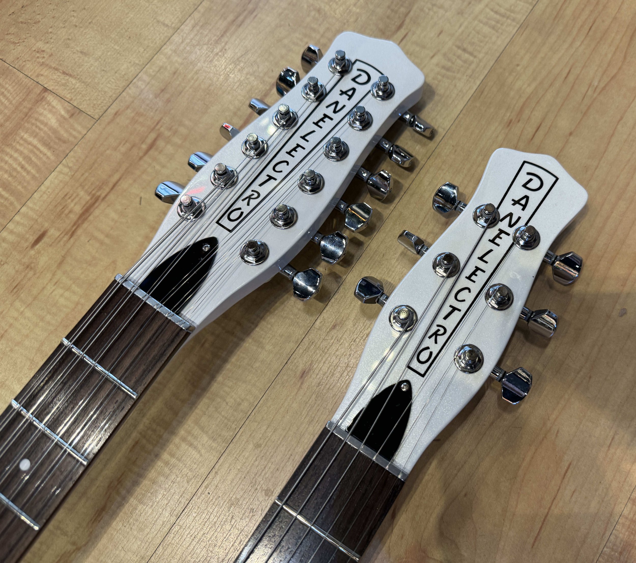Headstock of the Danelectro Doubleneck 6/12 Electric Guitar In White Pearl