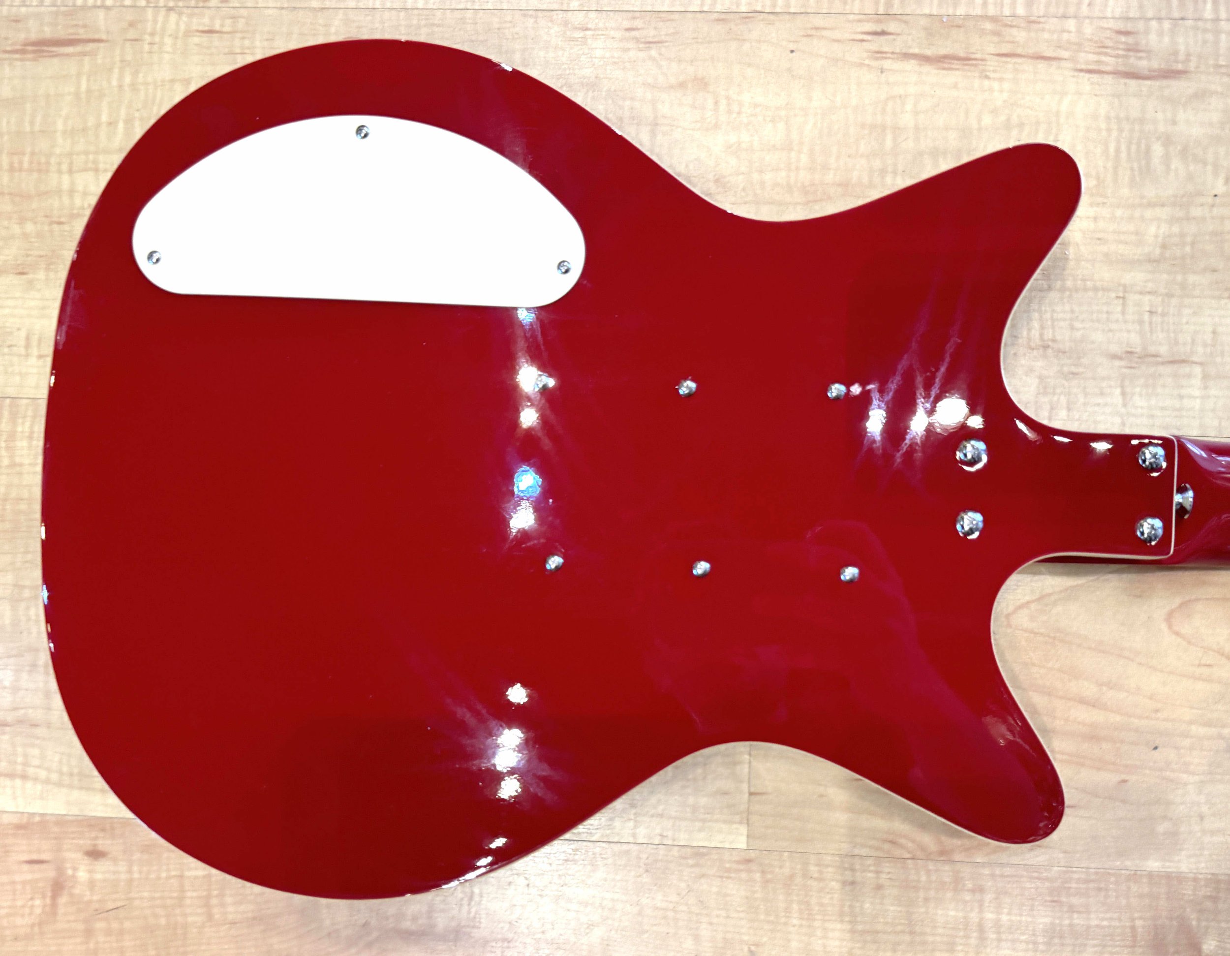 Back of the body of the Danelectro '59 Triple Divine Semi-Hollow Electric Guitar In Red
