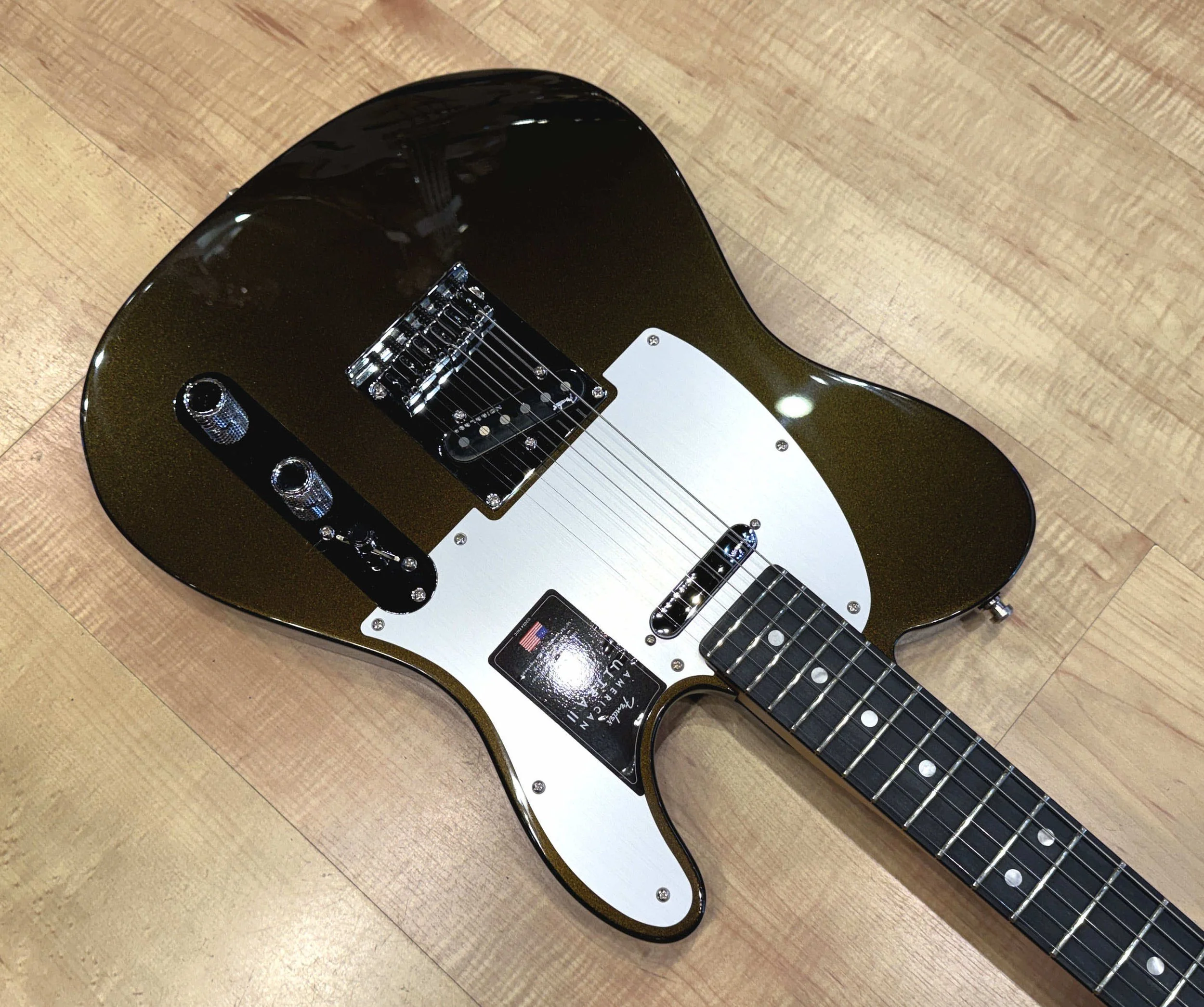 Pickguard of the Fender American Ultra II Telecaster Electric Guitar In Texas Tea