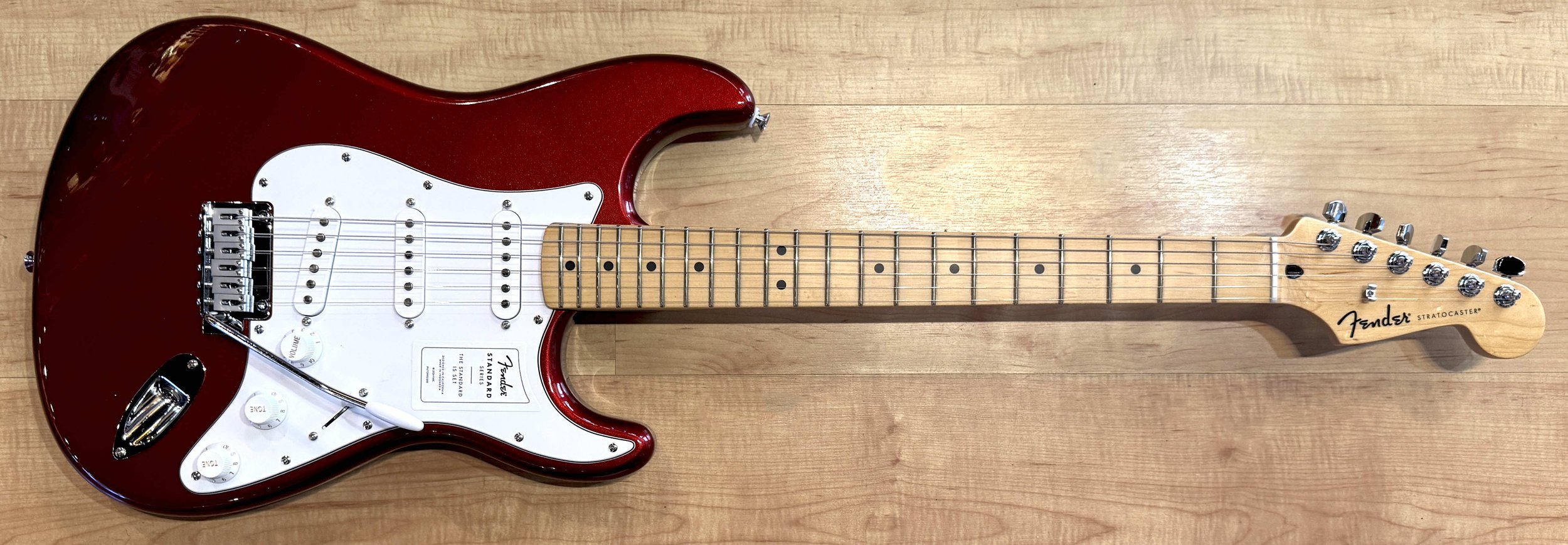 Front of the Fender Standard Stratocaster Electric Guitar In Candy Cola