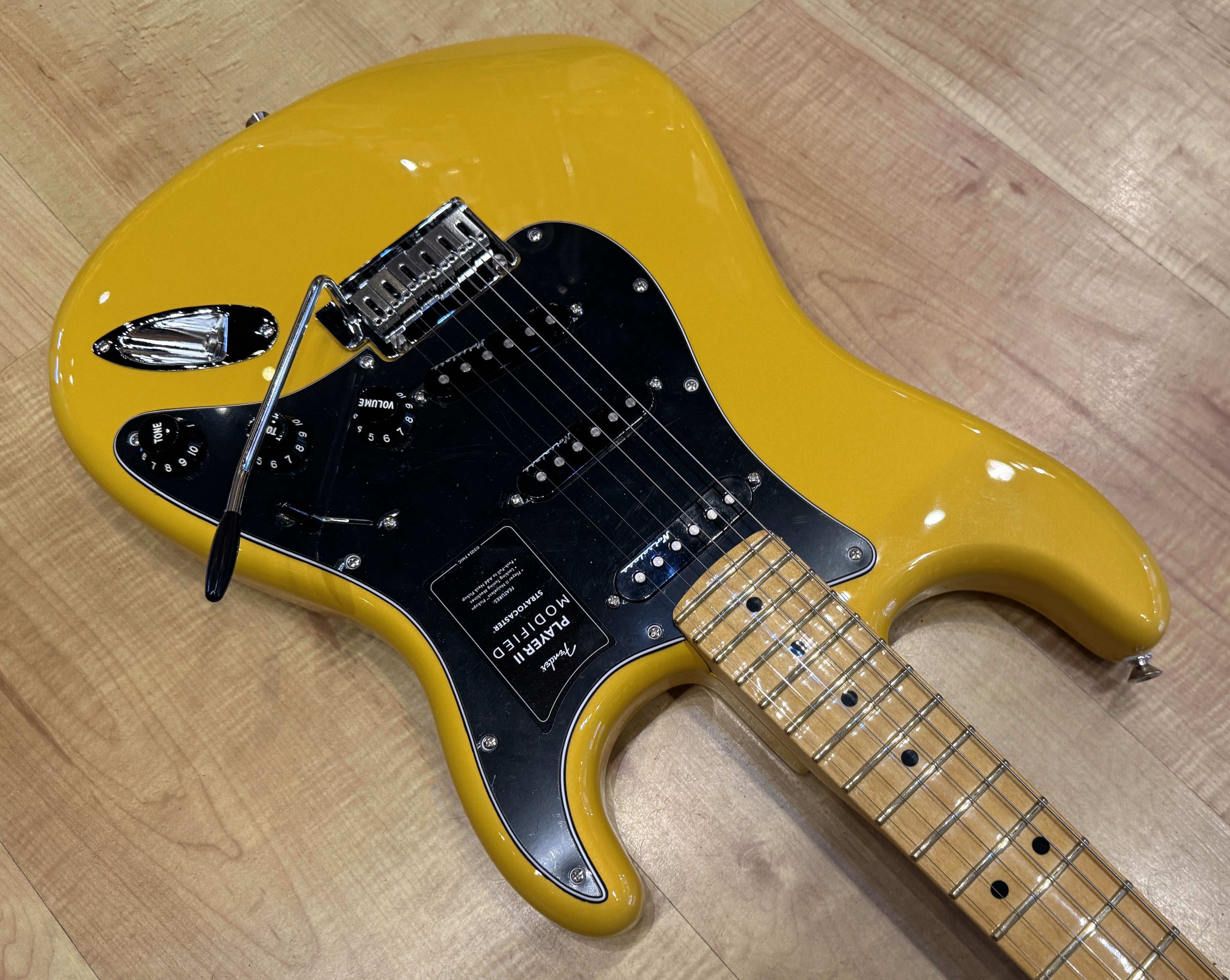 Pickguard of the Fender Player II Modified Stratocaster Electric Guitar In Sunshine Yellow