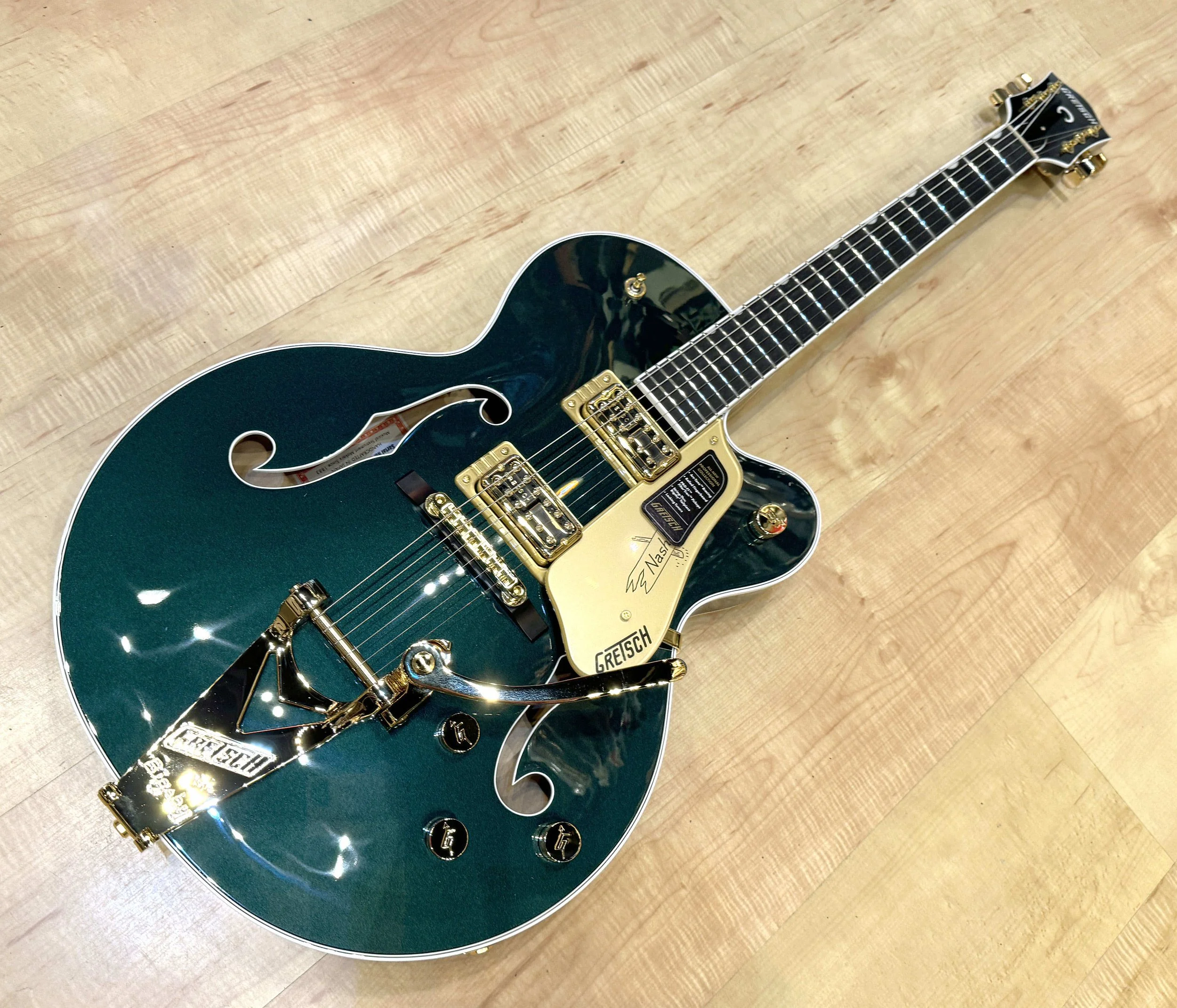 Full view of the Gretsch 6120 Nashville Hollow Body with String-Thru Bigsby and Gold Hardware In Cadillac Green