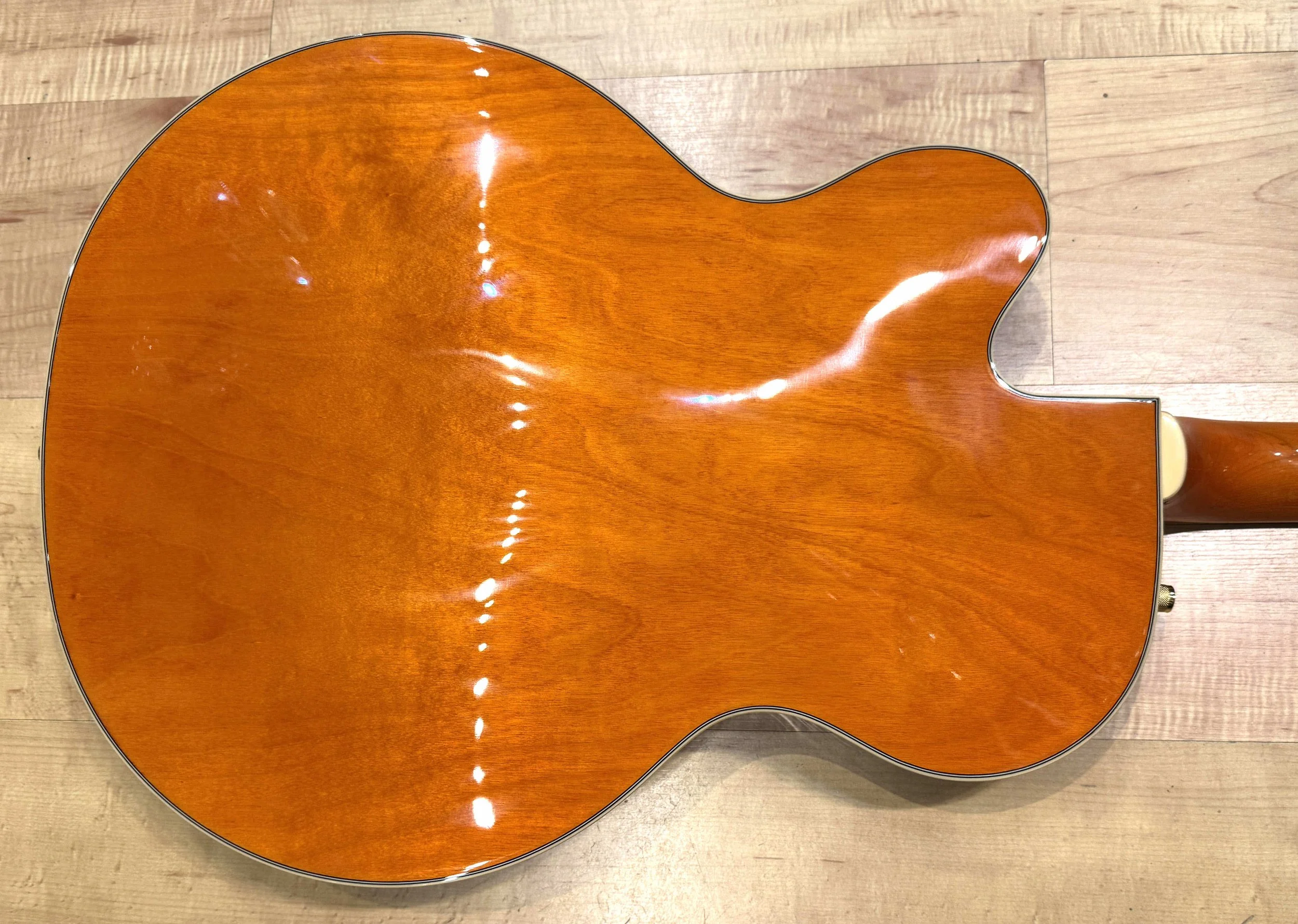 Back of the body of the Gretsch Synchromatic Nashville 6120 Hollow Body Single-Cut Electric Guitar with Bigsby In 50's Orange Stain