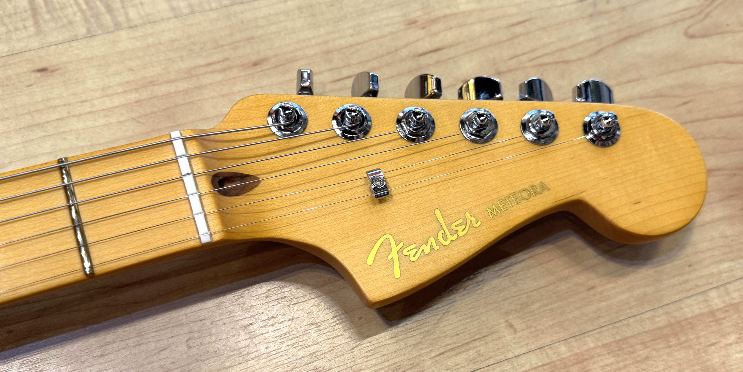 Headstock of the Fender American Ultra II Meteora Electric Guitar In Avalanche White