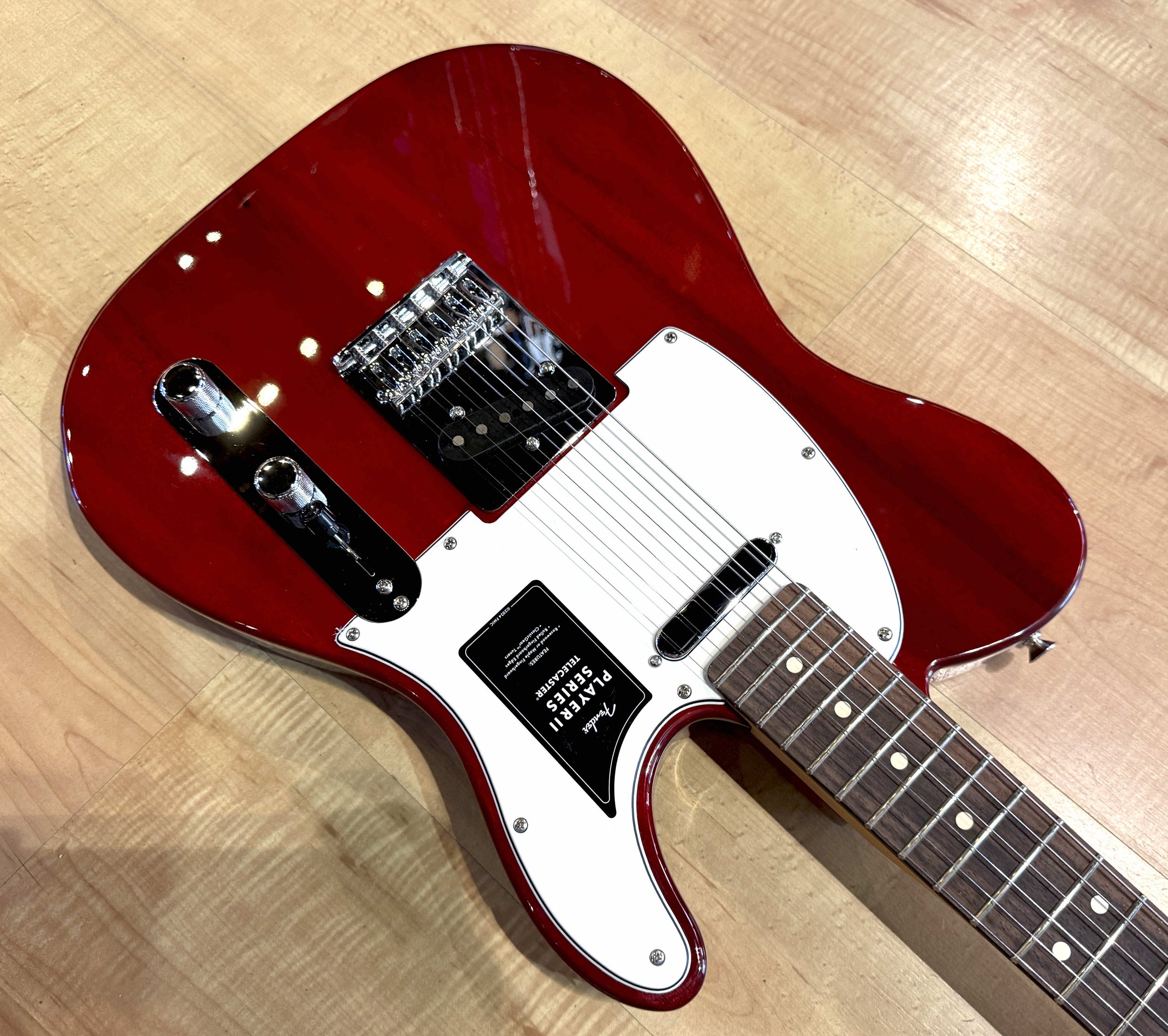 Pickguard of the Fender Player II Telecaster Chambered Electric Guitar In Transparent Cherry