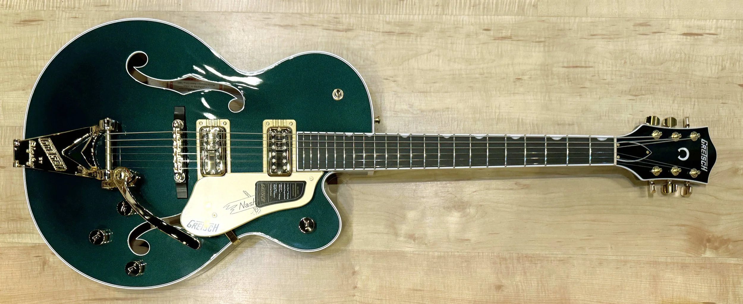 Front of the Gretsch 6120 Nashville Hollow Body with String-Thru Bigsby and Gold Hardware In Cadillac Green