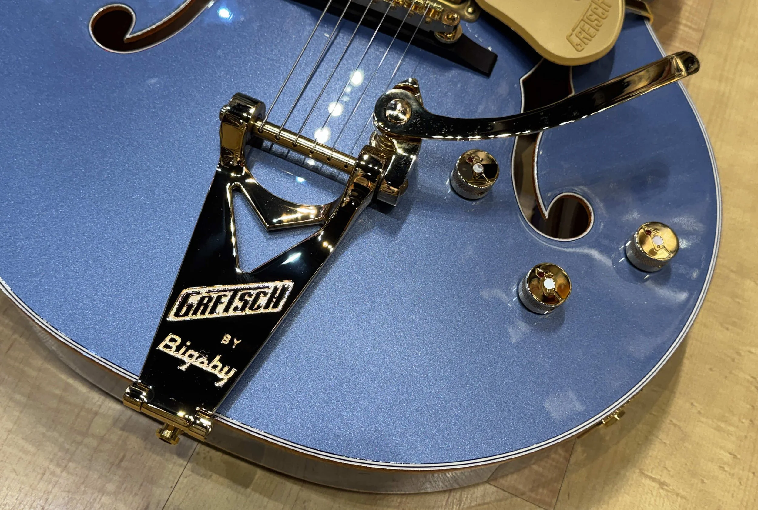 Tailpiece of the Gretsch Falcon Hollow Body Single-Cut Guitar with String-Thru Bigsby and Gold Hardware Cerulean Smoke Blue