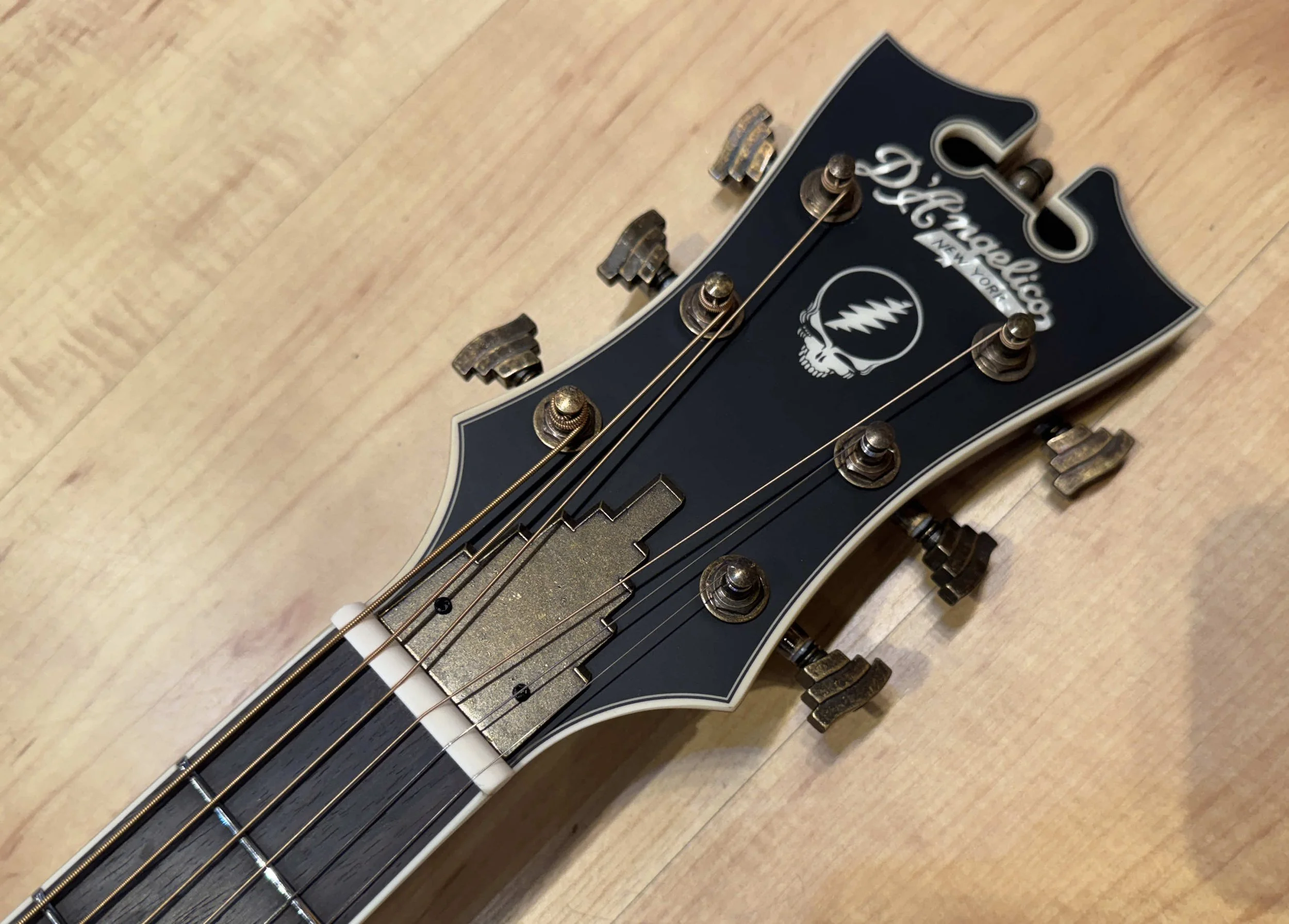 Headstock of the D'Angelico Grateful Dead Tammany Acoustic Electric Guitar