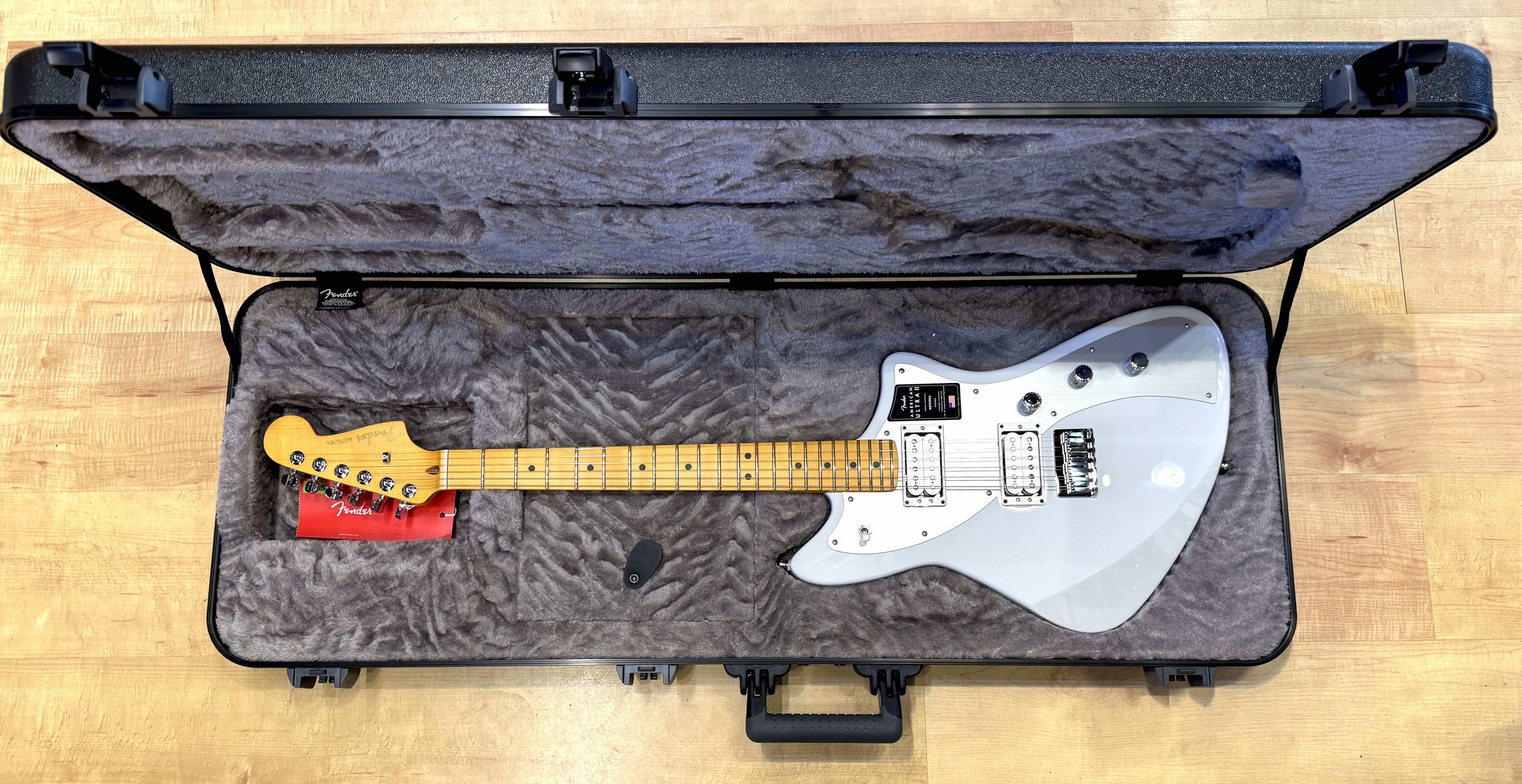 Inside the case of the Fender American Ultra II Meteora Electric Guitar In Avalanche White