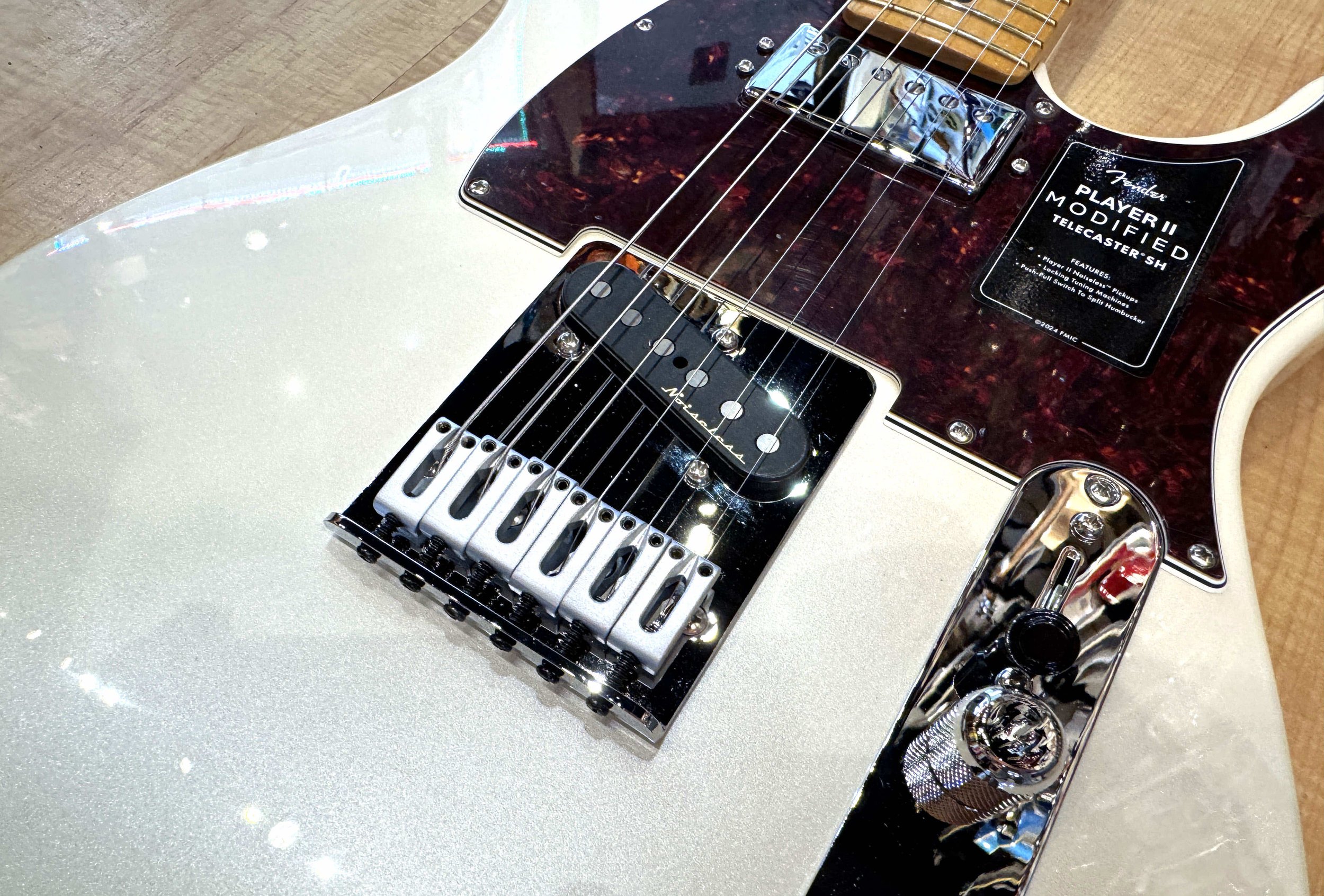 Bridge of the Fender Player II Modified Telecaster SH Electric Guitar in Olympic Pearl White