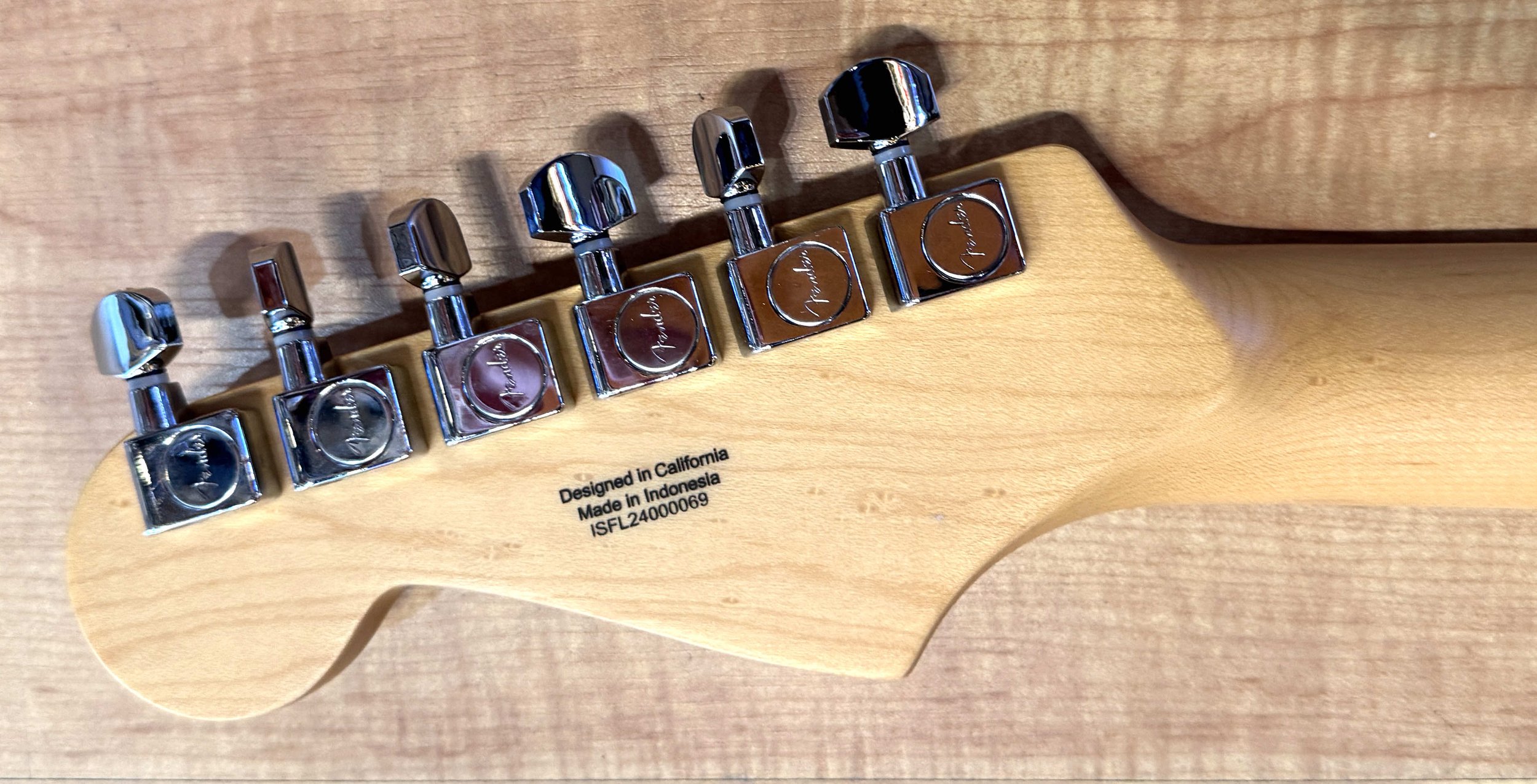 Tuners of the Fender Standard Stratocaster Electric Guitar In Candy Cola