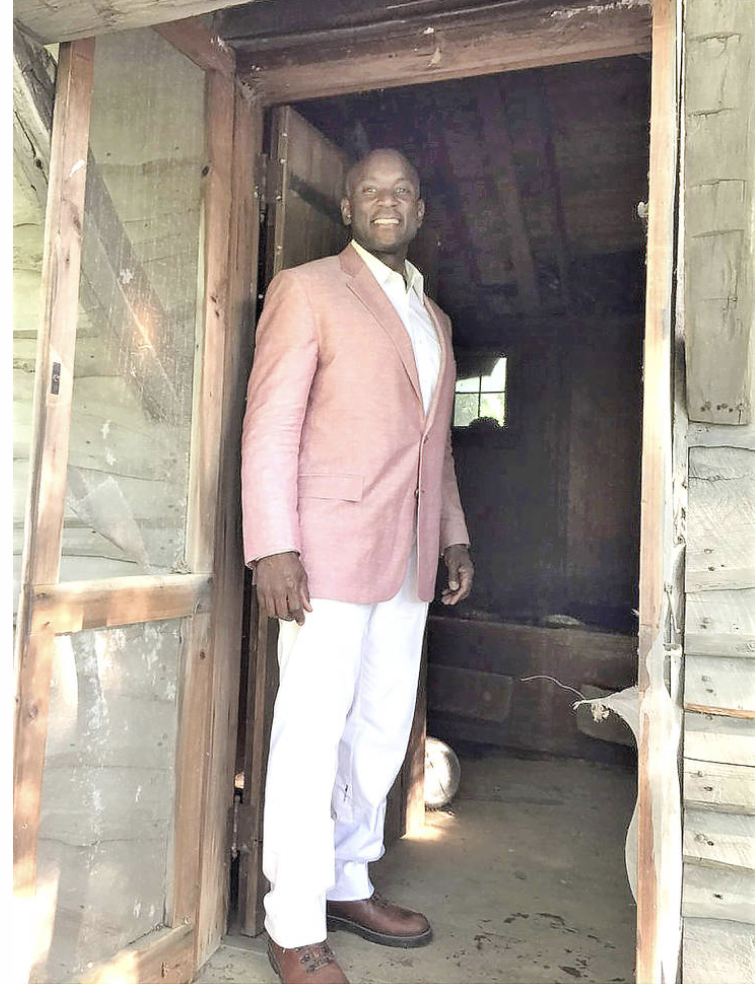 Rufus Jones at the entrance of Johnson's writing cabin 