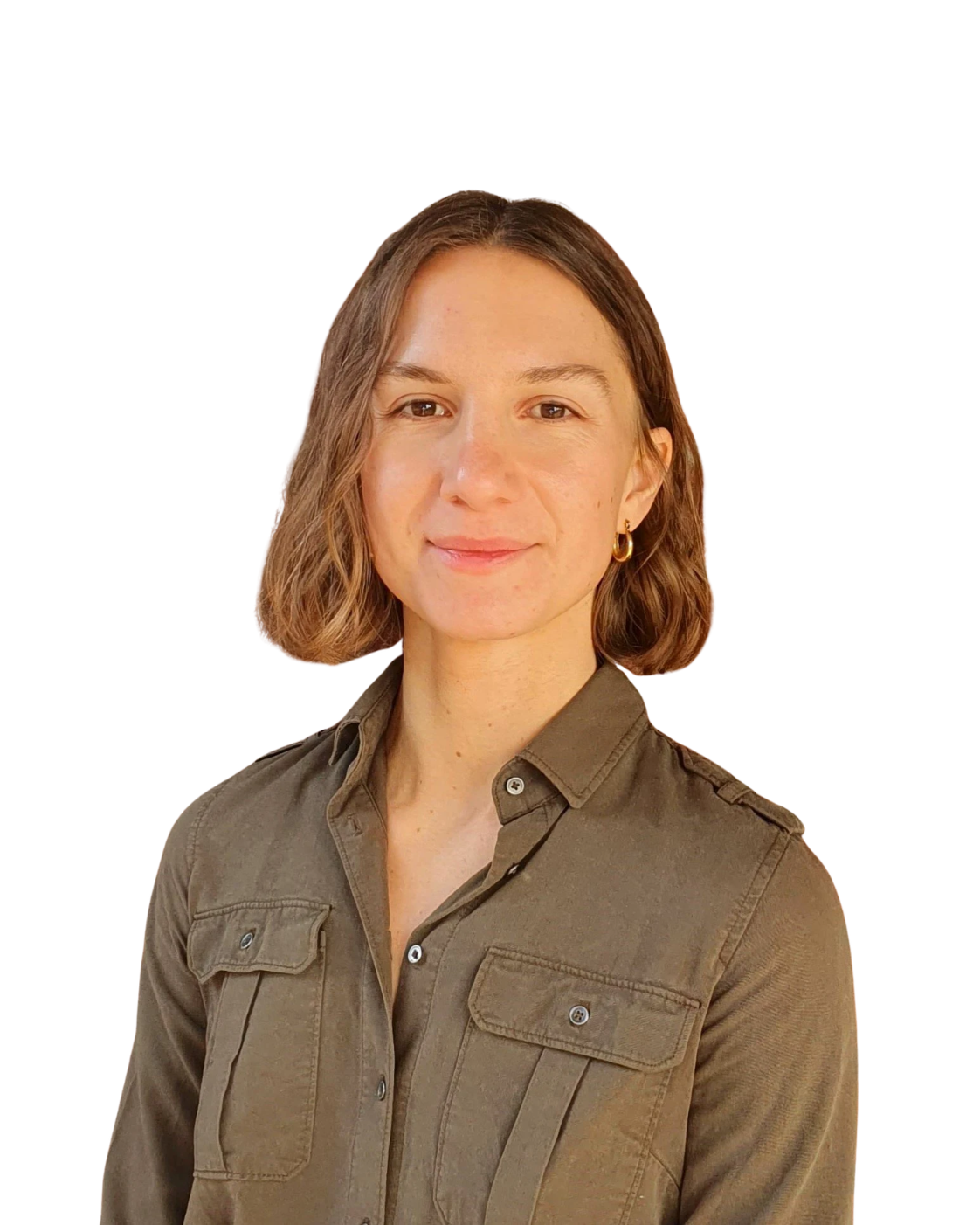 Headshot of Claire Hlavacek standing in front of a brick wall.