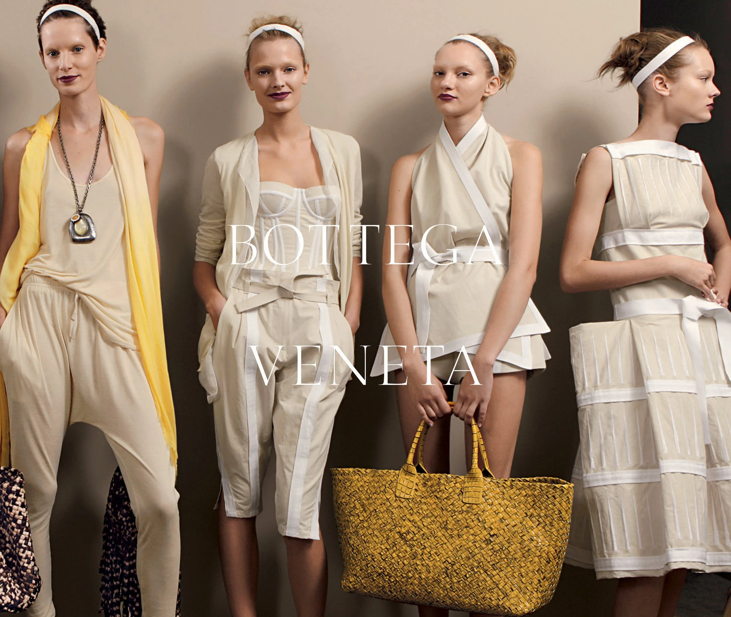 Four models stand against a neutral wall, wearing beige and cream designer outfits with accessories. The text 'Bottega Veneta' overlays the image.
