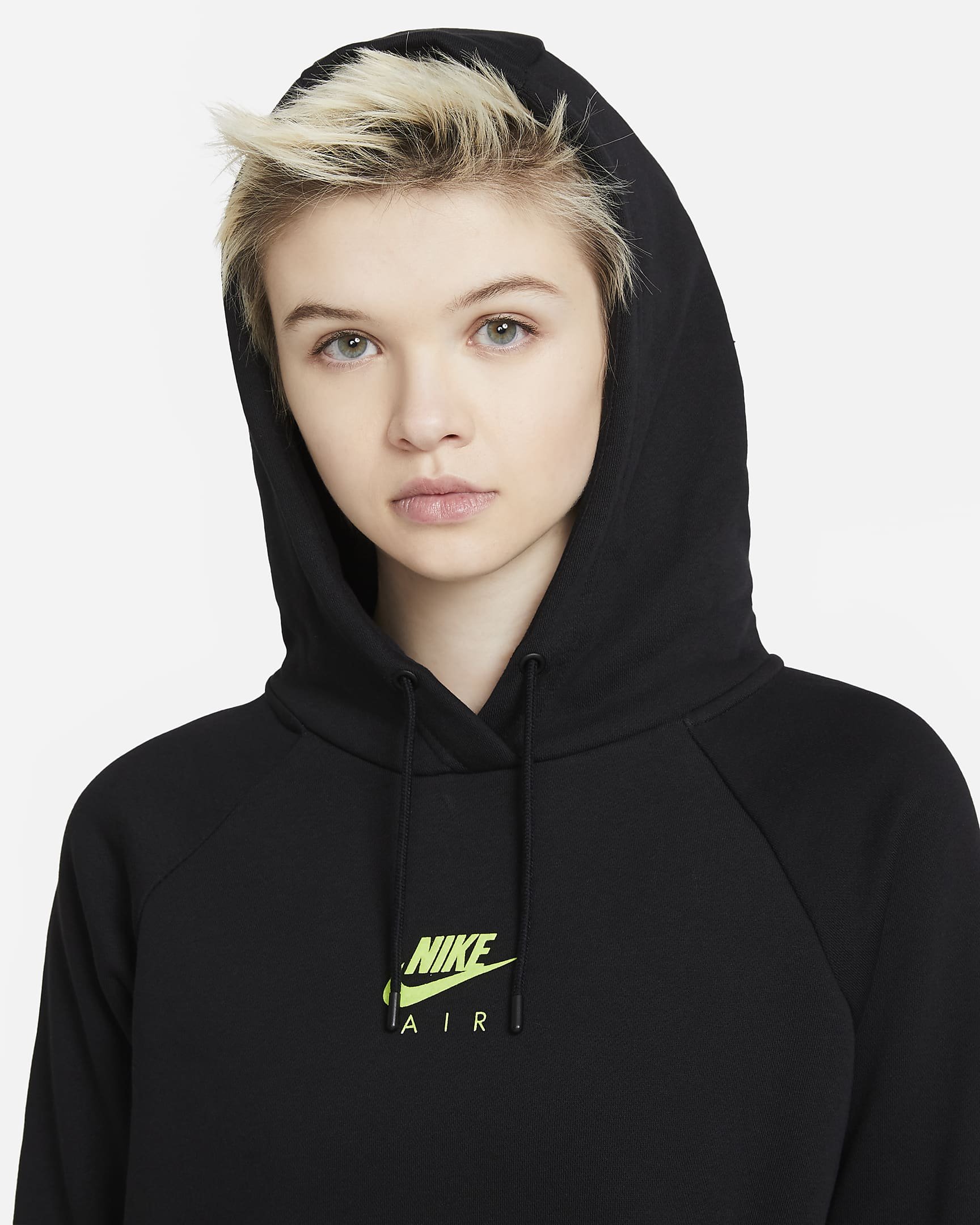 A young woman with short blond hair wearing a black Nike hoodie with the Nike Air logo in neon green on the front.