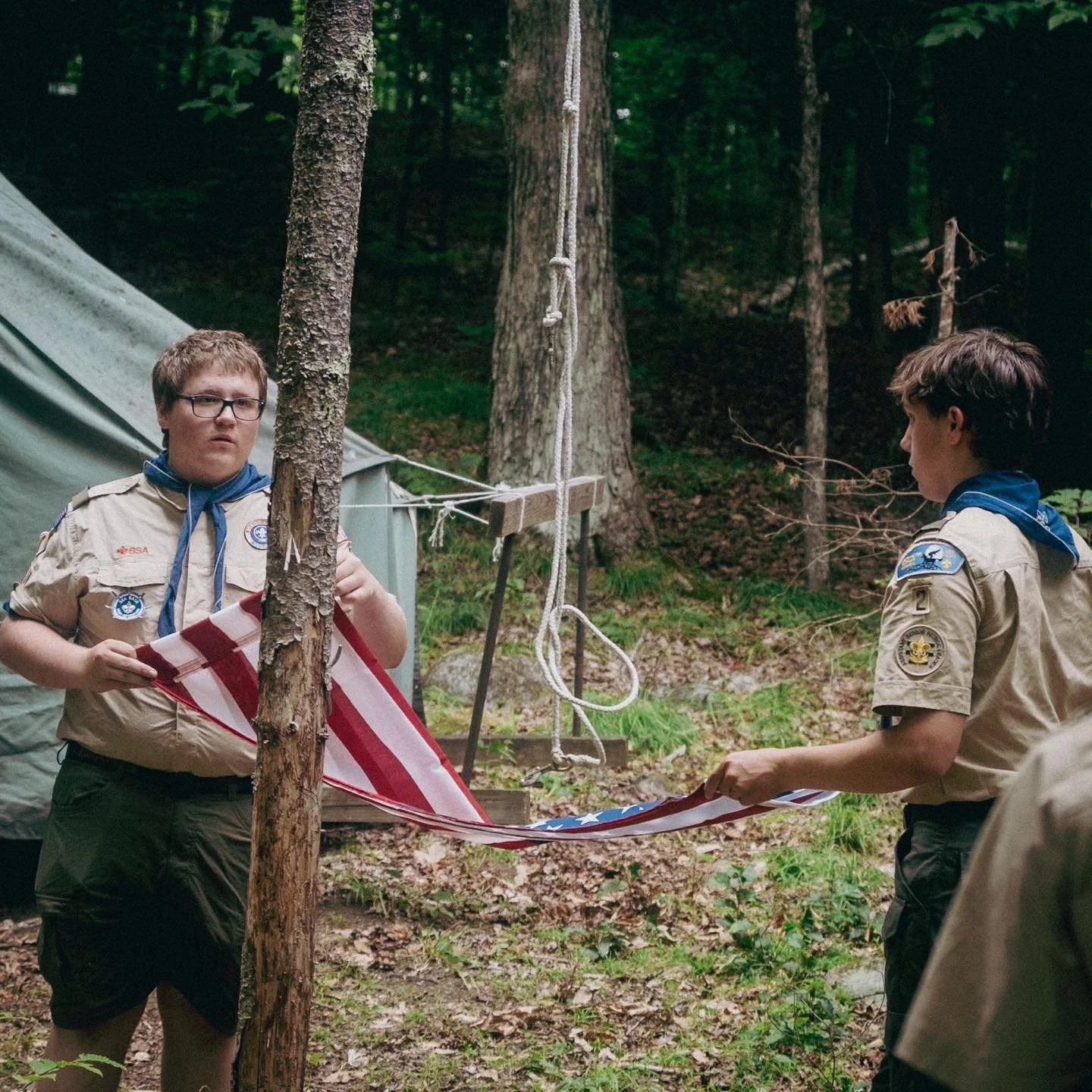 Citizenship is core to Scouting values, even at summer camp. Every morning, before Scouts leave for a day of adventure, we stop for a moment to proudly raise the flag, using a tree trunk as a flagpole. And every day before nightfall, we respectfully 