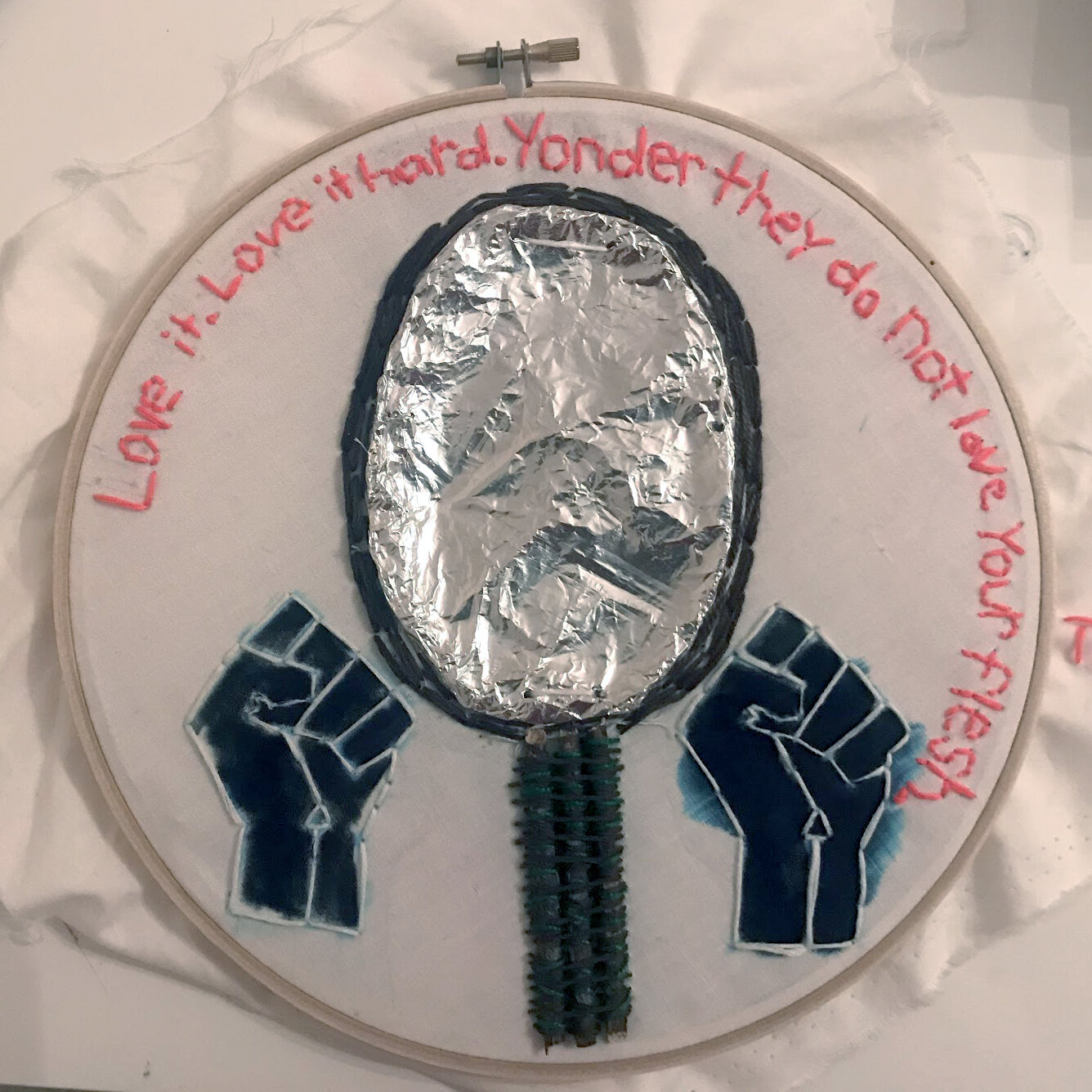 Tatum M.
"Reflect"
In my embroidery I was inspired by a quote by Baby Suggs, where she says “Love it. Love it hard. Yonder they do not love your flesh”(103). She says this to the people in the clearing in the forest and to me, this whole page and qu