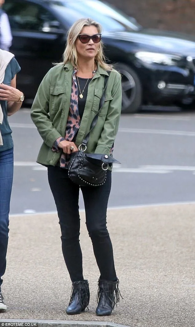 Kate Moss and a male pal wear MATCHING khaki jackets.jpeg