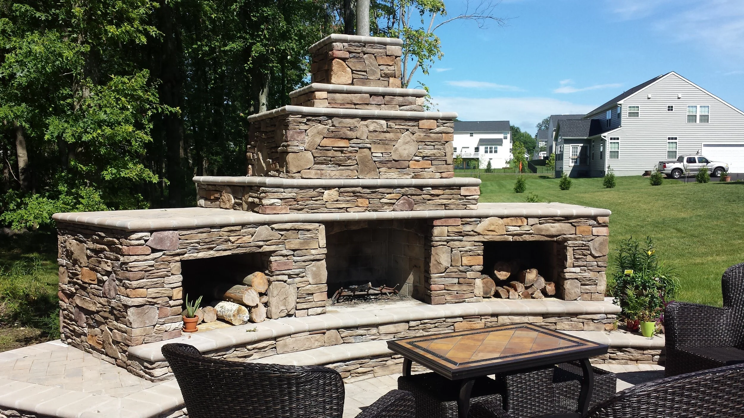 Outdoor fireplace with wood storage