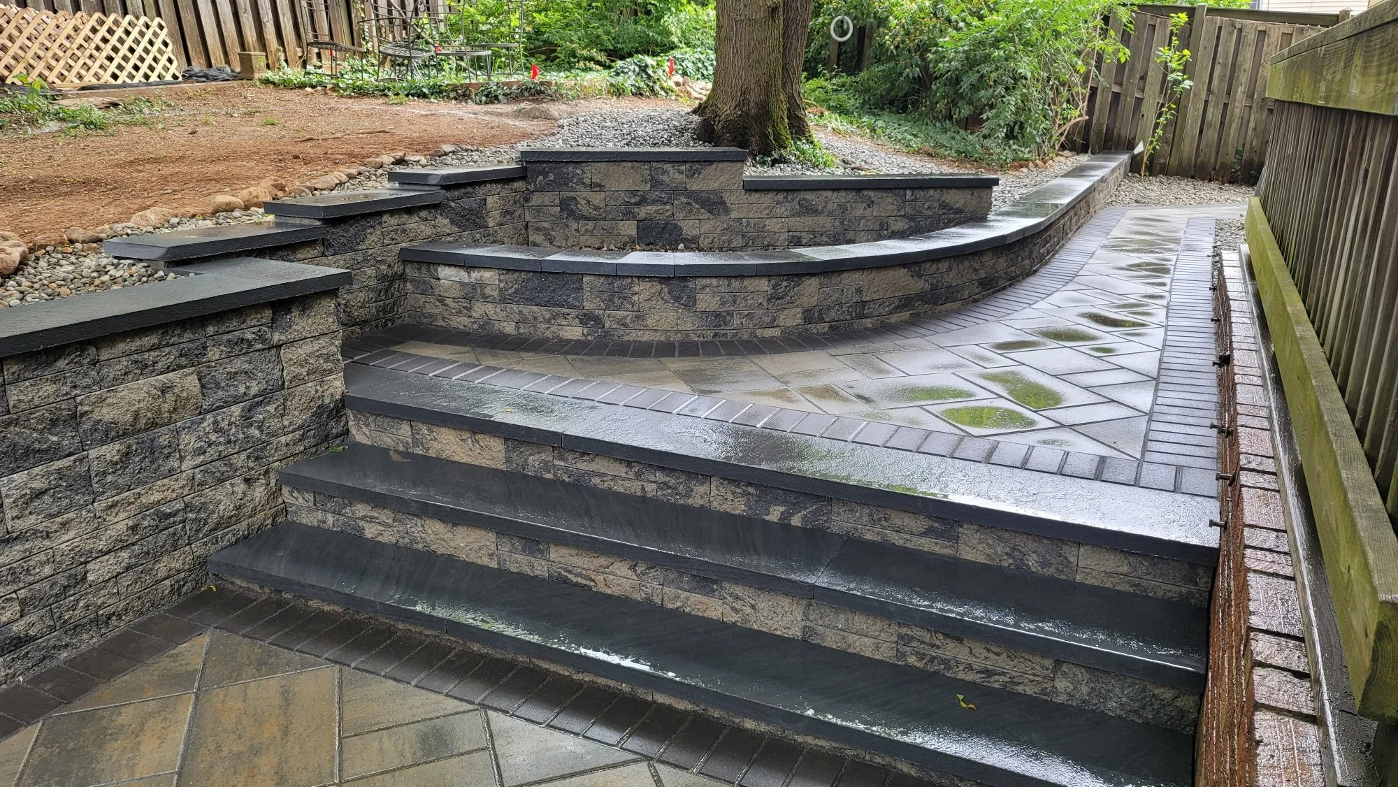 Cambridge Pavers, wall block and caps creating a walkway and retaining walls.