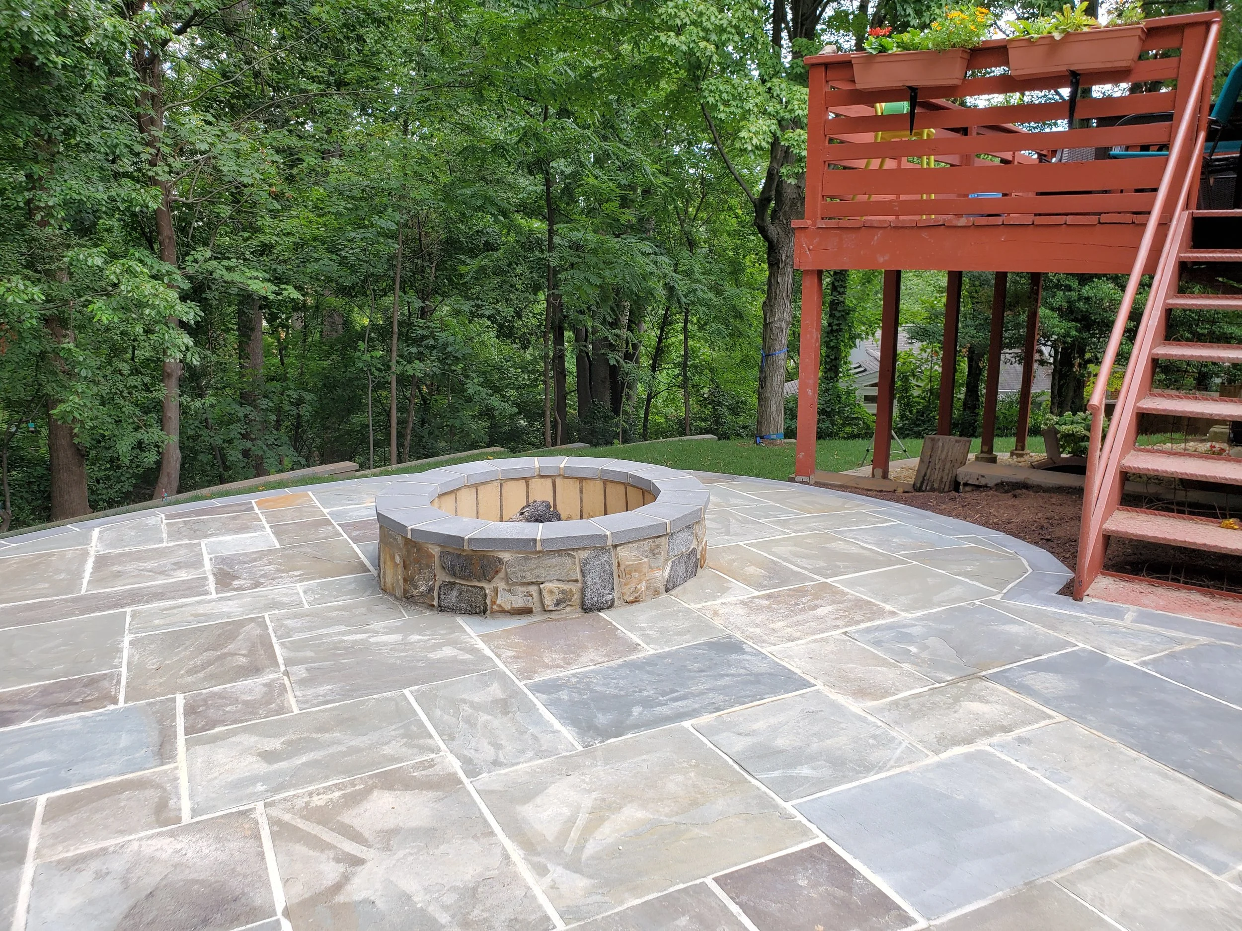 Natural flagstone patio with fire pit