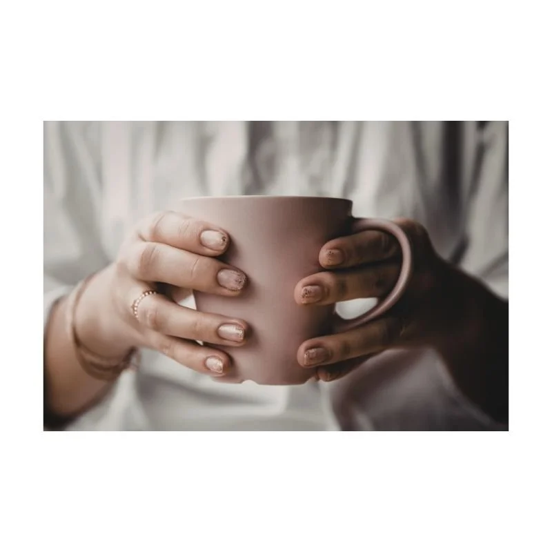 Woman holding a warm mug — trauma therapy consultation in Round Rock Texas