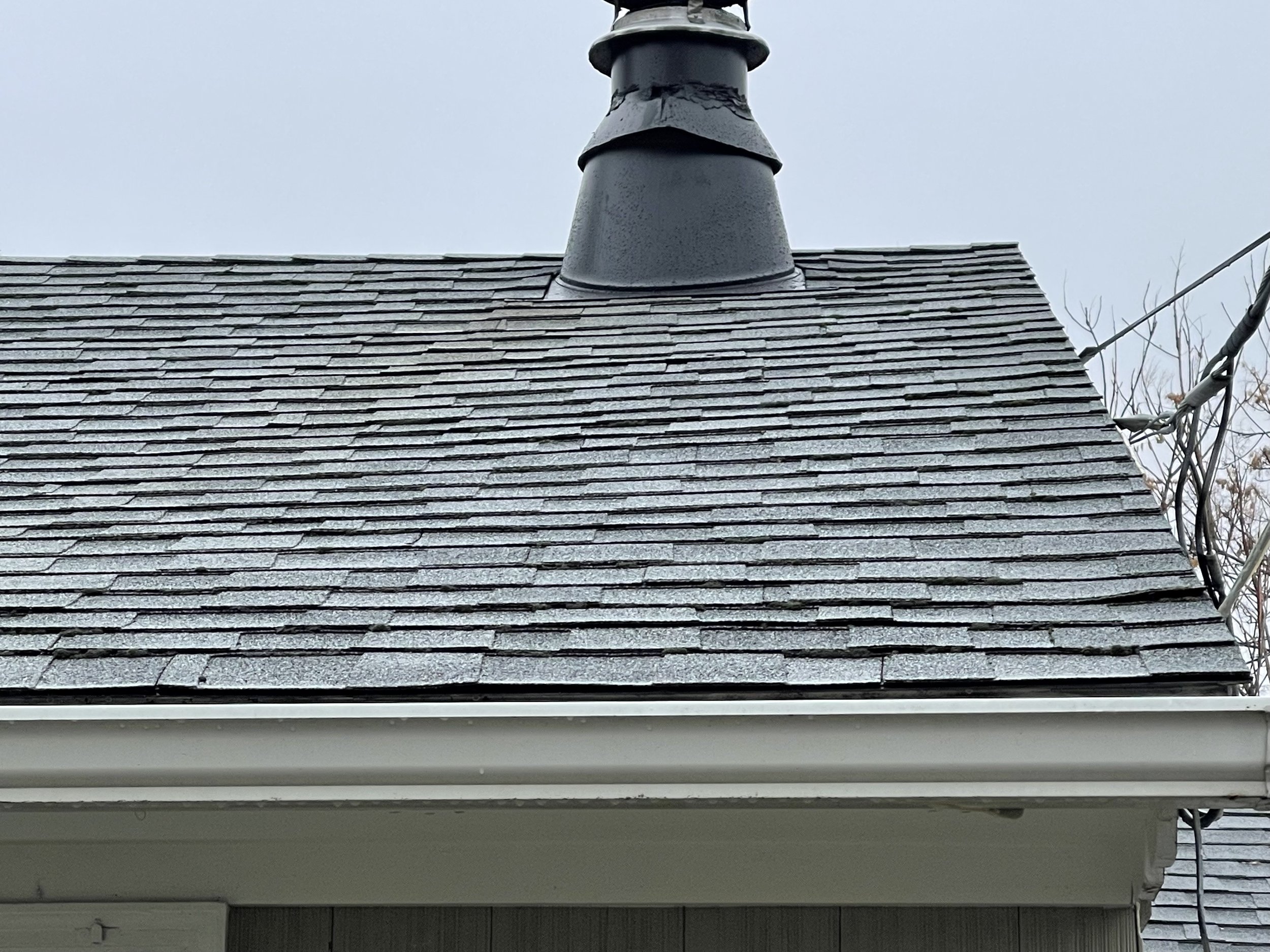 Roof is clearly newer. A few lifted shingles here and there.