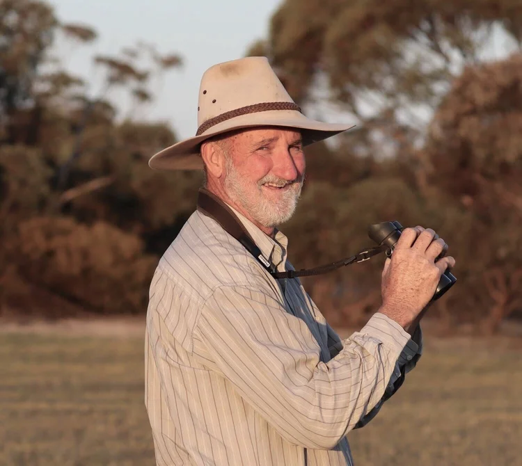 Phil Murdoch with binoculars in the Big Desert