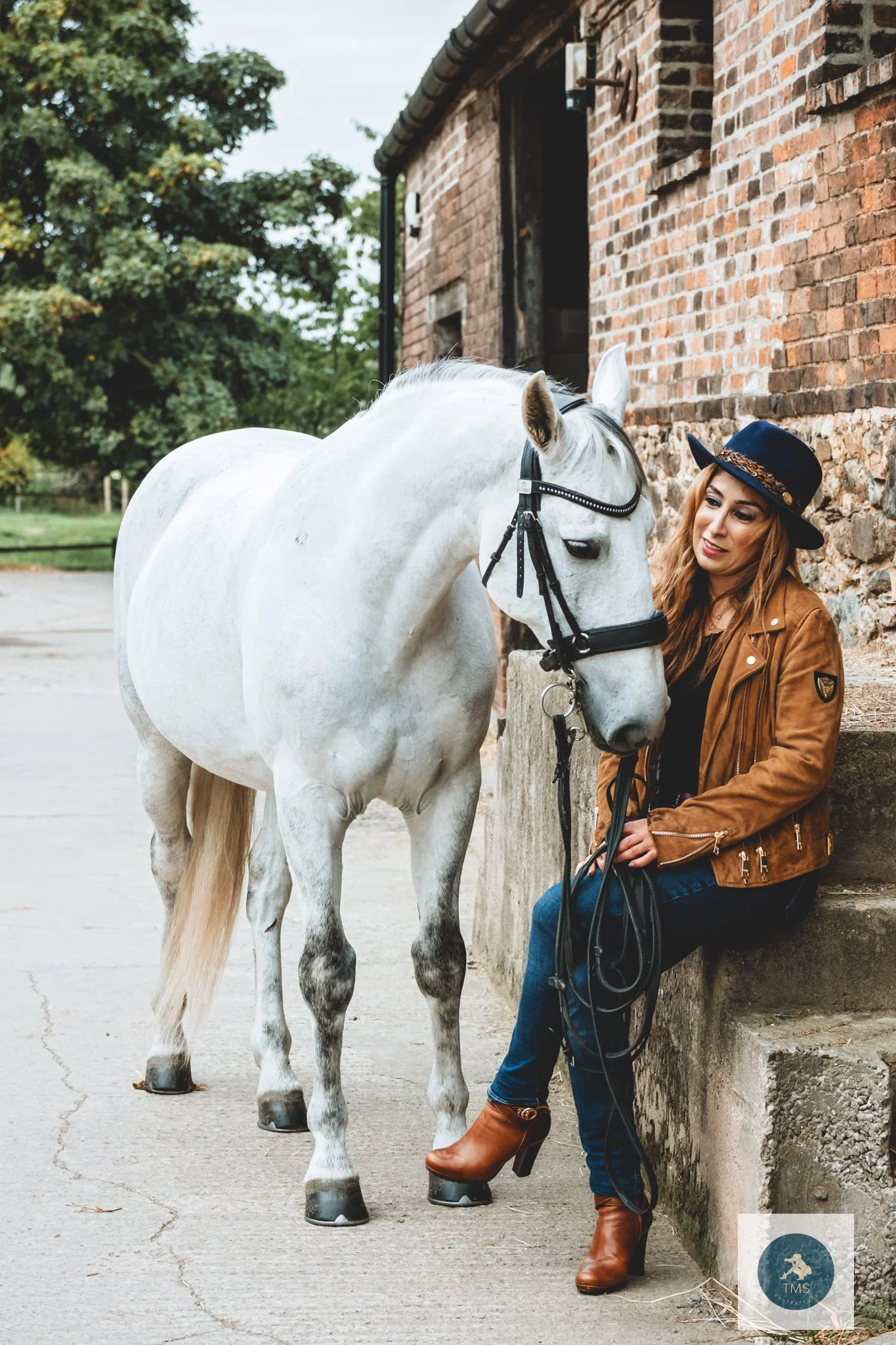 Pari wearing Holland Cooper clothing for her equine portrait session with Ferrari