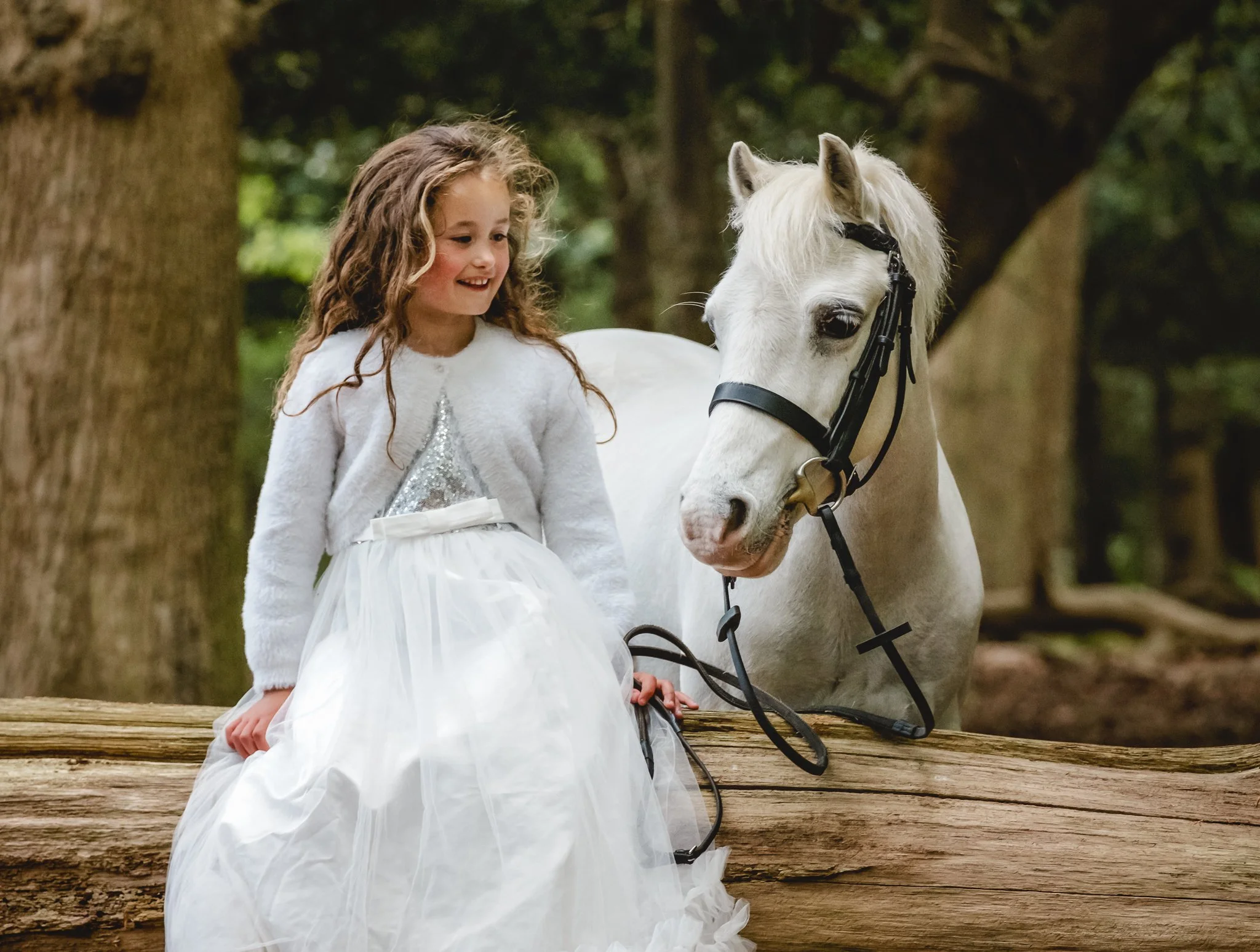young rider with her first pony outdoors