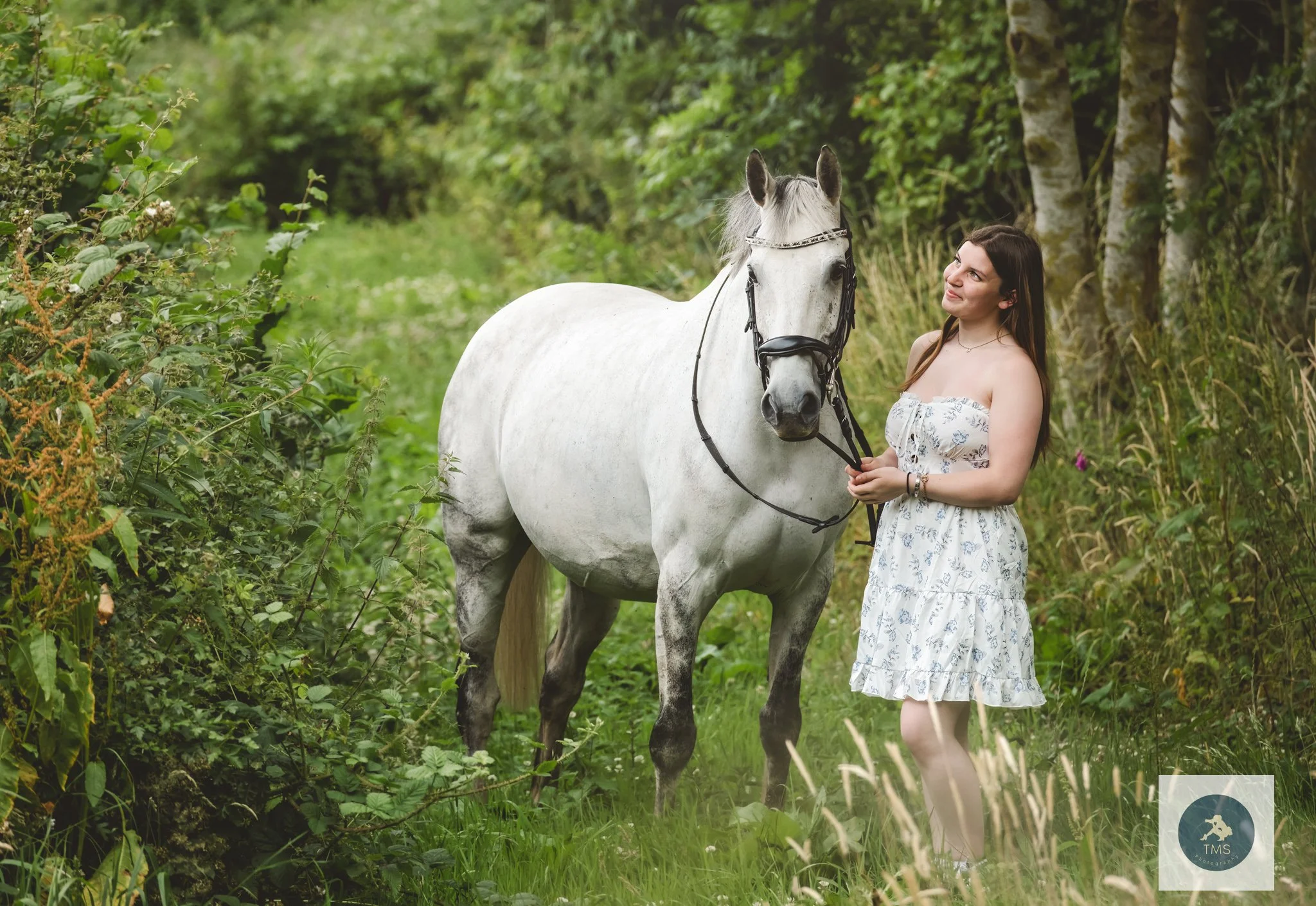 Liv standing with her horse Milly during a summer photoshoot in Hartshorne, Derbyshire