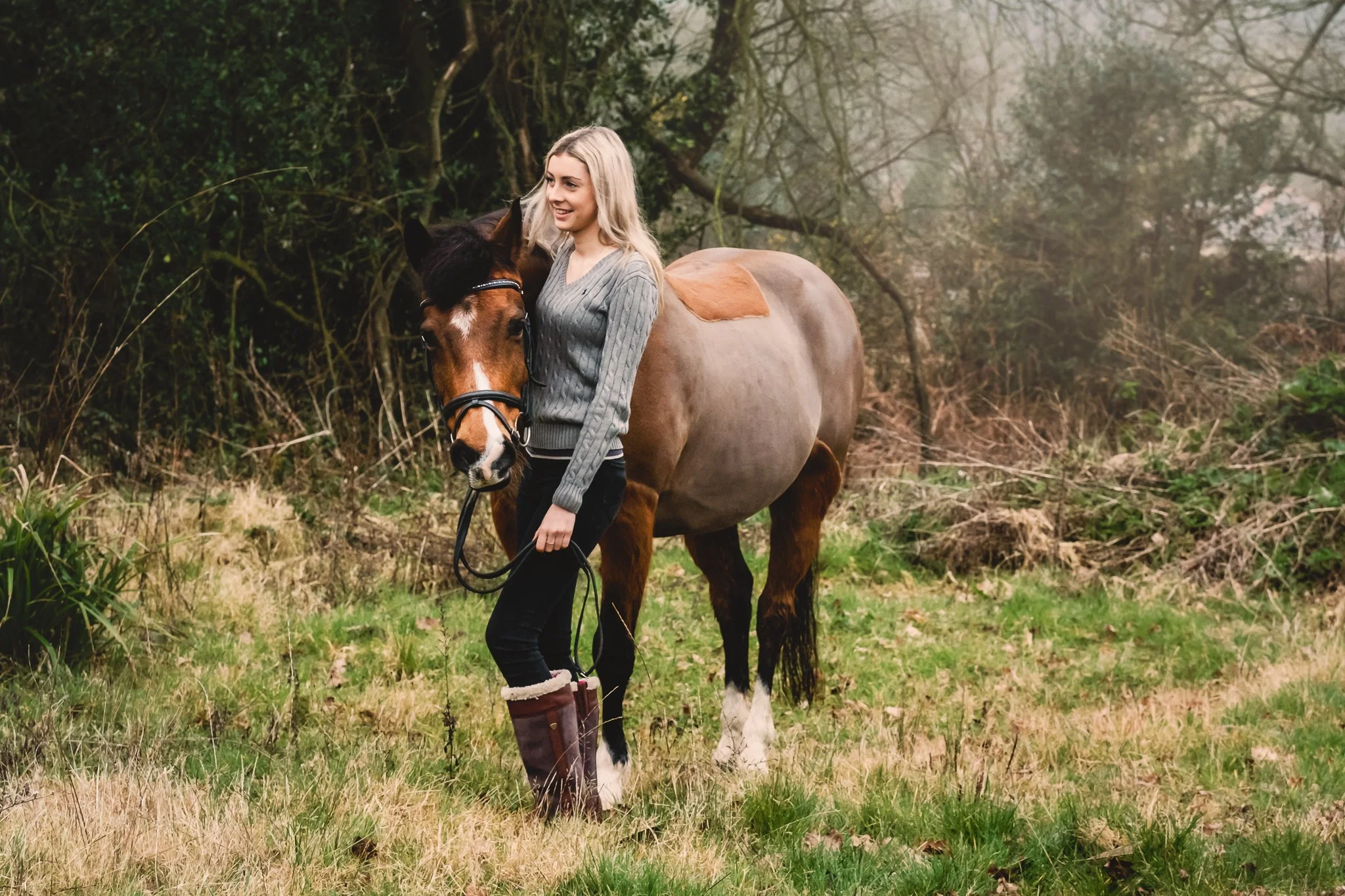 Pony portrait with owner in countryside setting