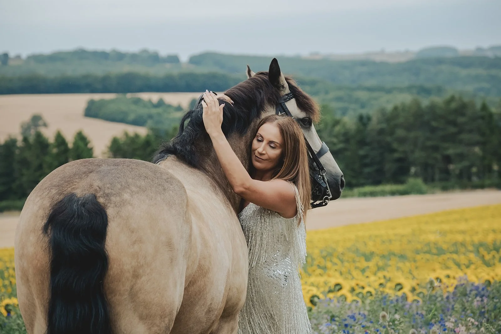 Owner wearing cocktail dress beside her Connemara pony