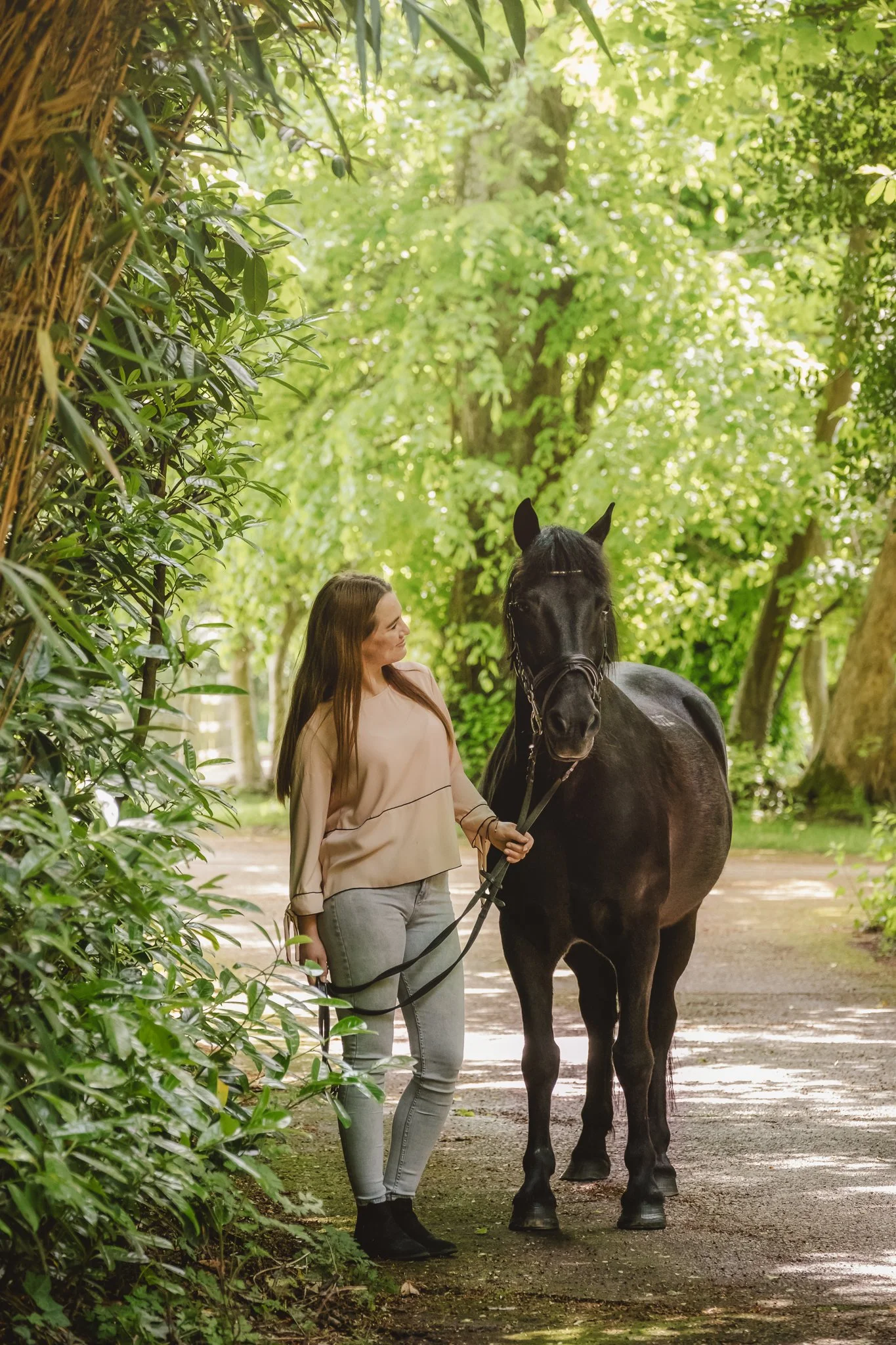rider bonding with pony in forest setting candid moment