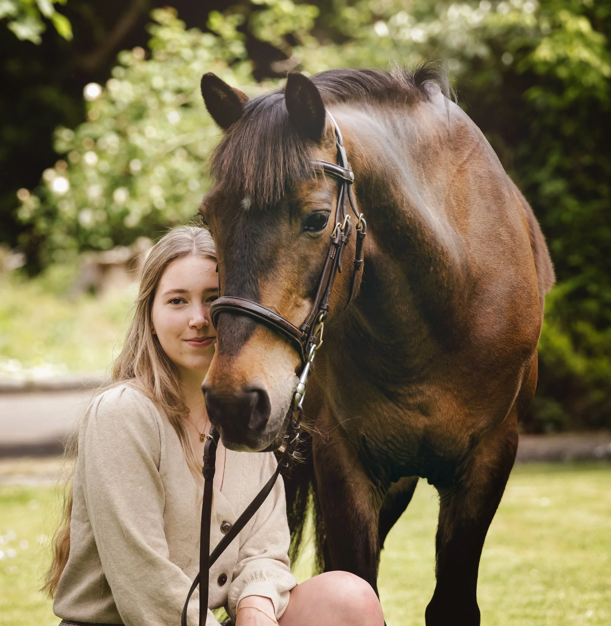 Horse and owner portrait beside stable yard
