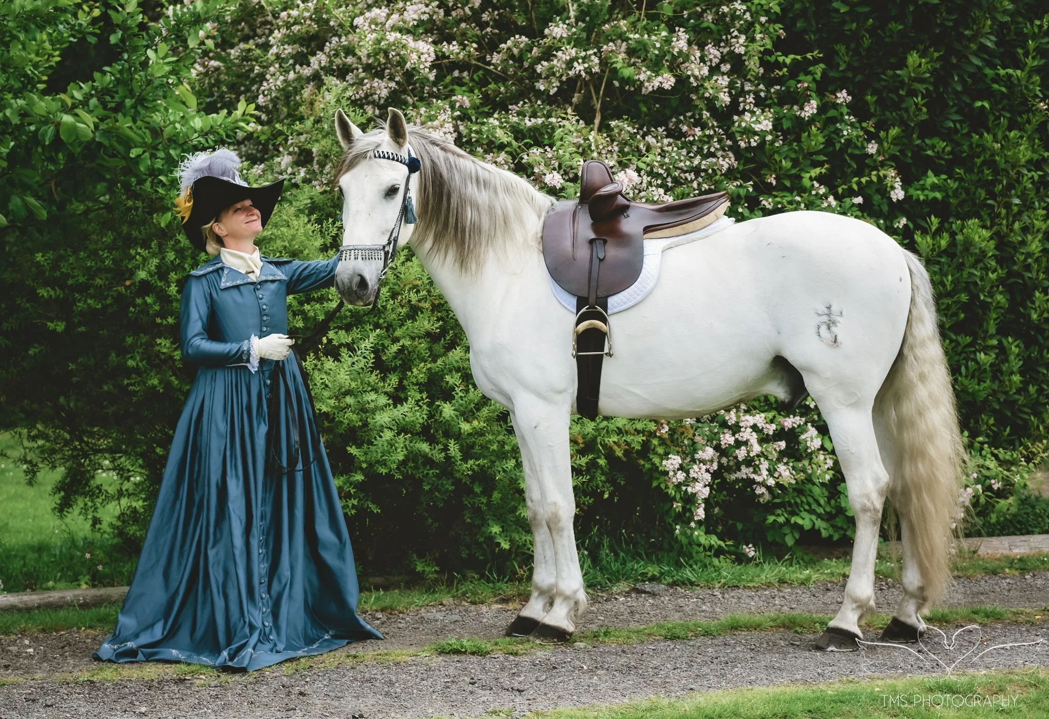 Eighteenth century inspired side saddle portrait with feathered hat