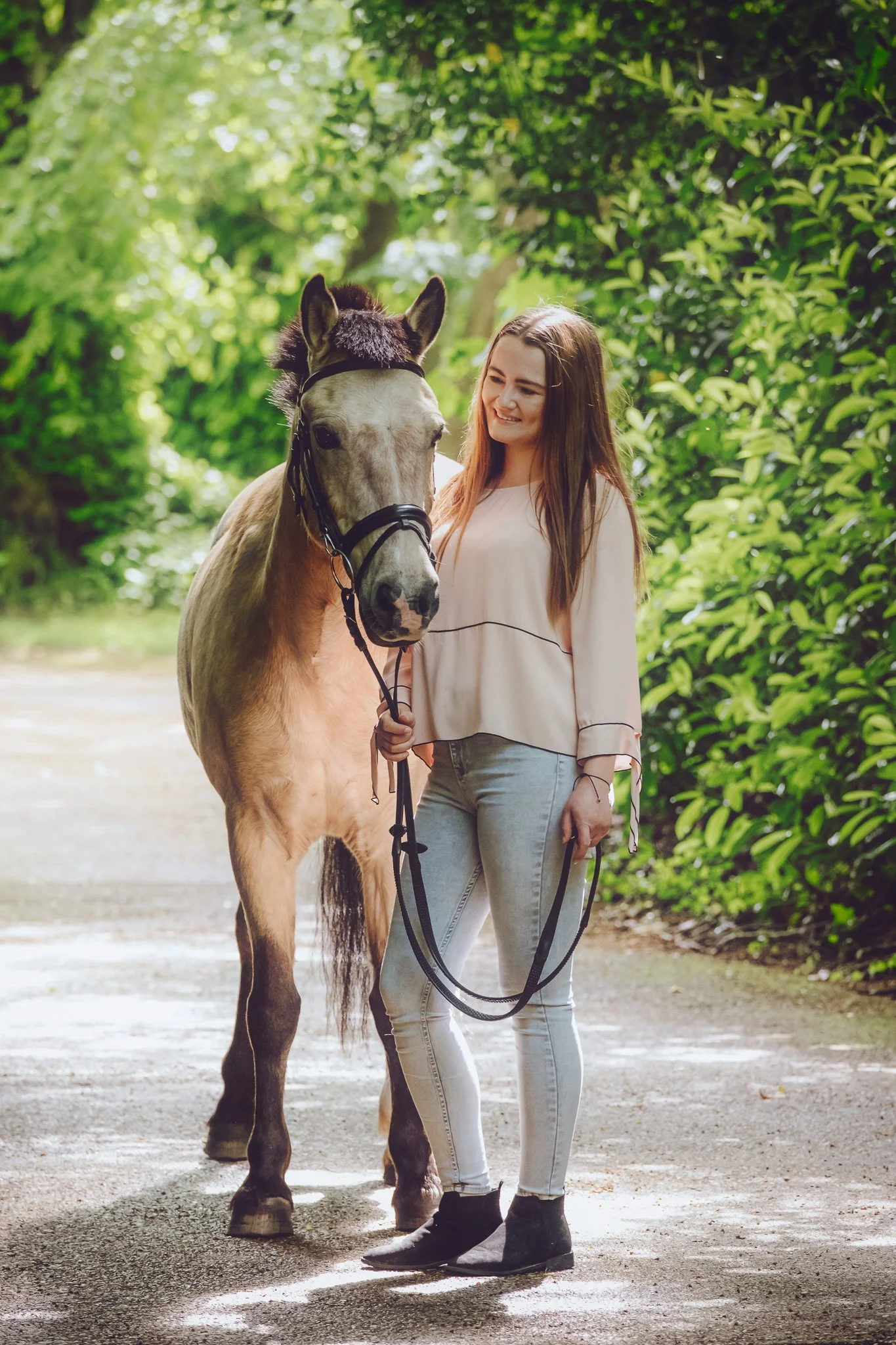 a girl with her dun pony having a photoshoot in the new forest