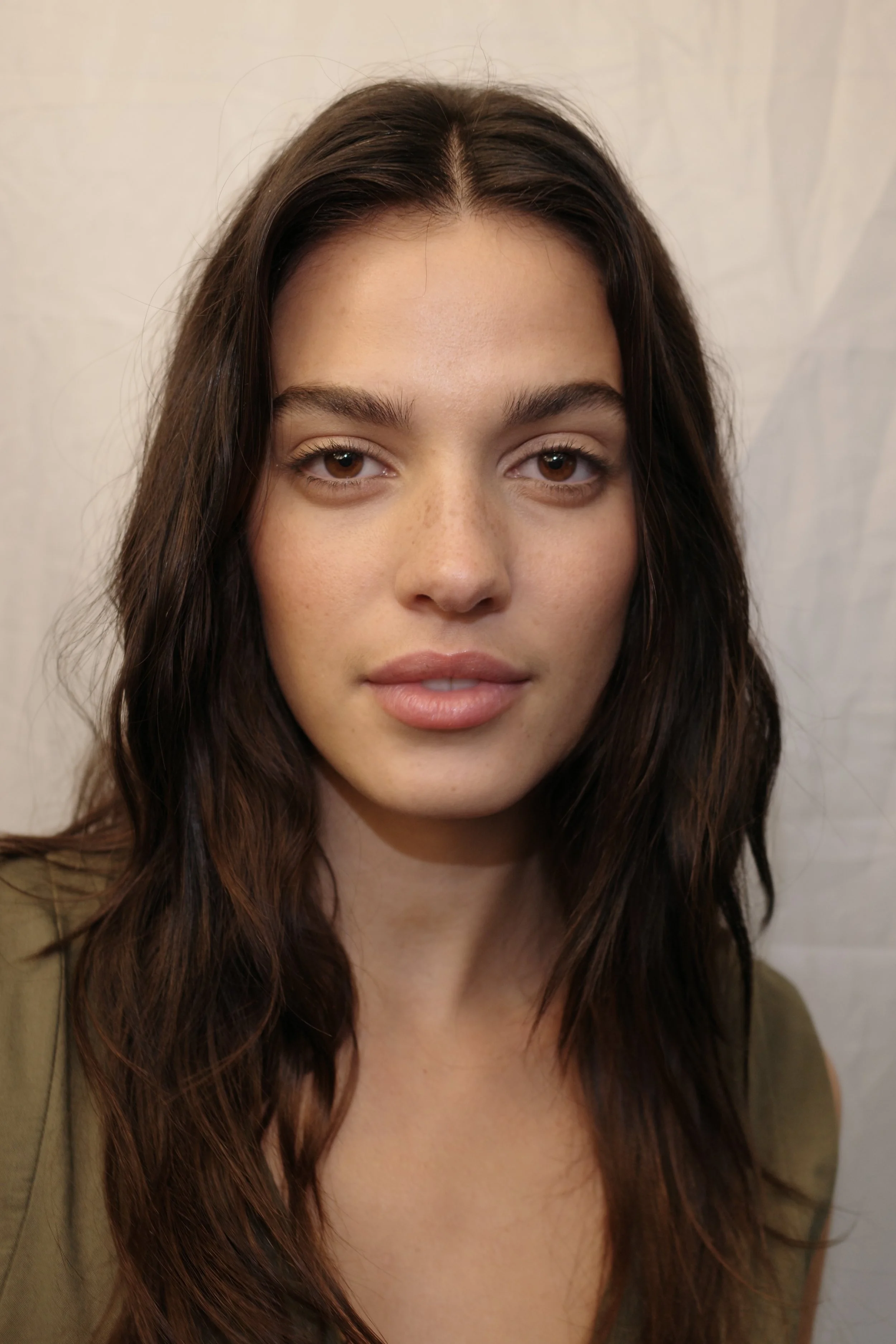 Behind the scenes of a fashion e-commerce photoshoot in San Francisco Bay Area featuring European Spanish woman 25 years old with glowy, radiant skin and natural makeup by Angela Shippen.
