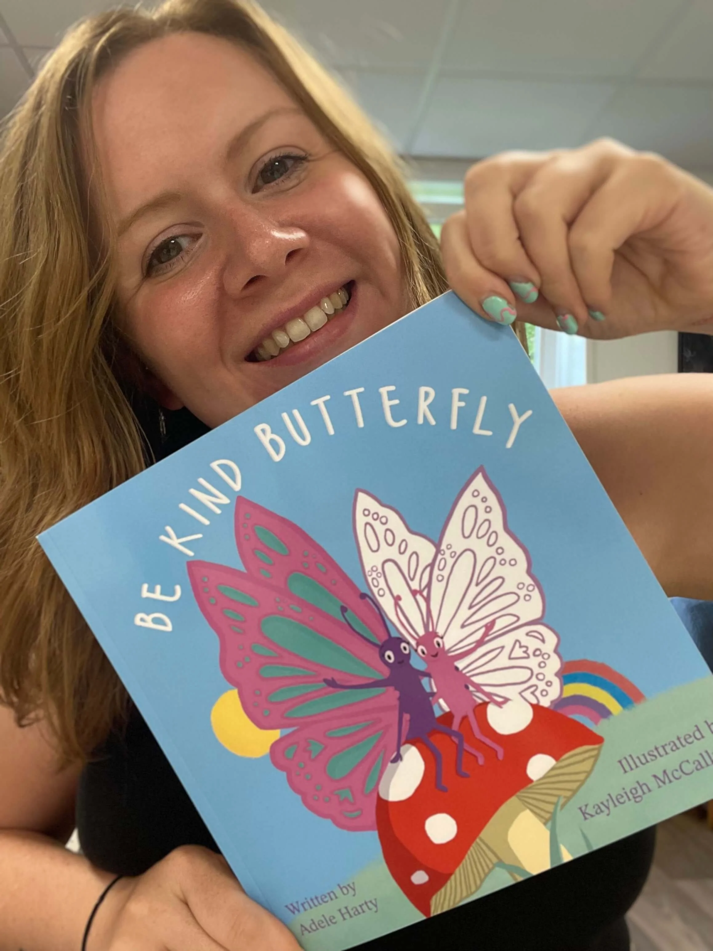 kayleigh holding be kind butterfly book