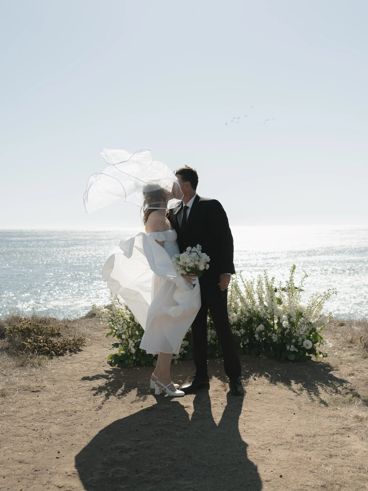 Olivia and Lars&rsquo;s windswept ceremony was such a highlight of our year 🌊 The love they share and the support that surrounds them was so evident throughout their entire day. Looking back at all of their favorite people after being officially mar