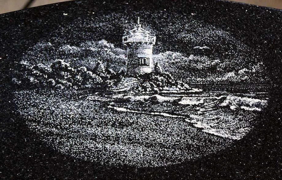 Etched lighthouse scene with waves and clouds