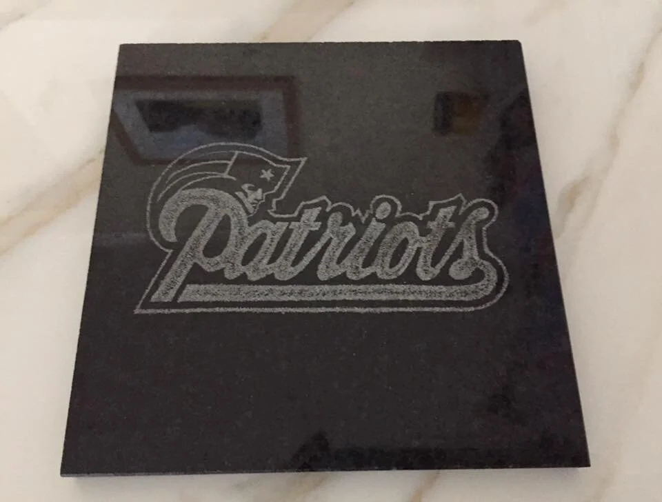 Black tile with "Patriots" in script and stylized logo