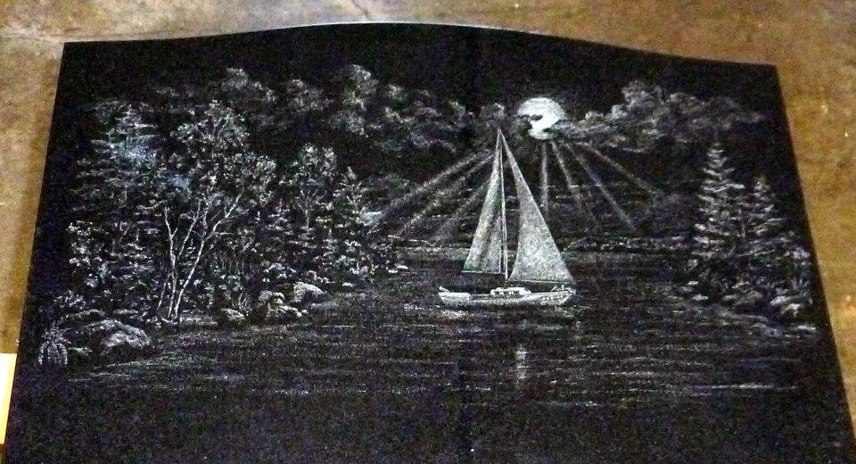 Chalk art depicting a sailboat on a lake with surrounding trees and a full moon in the sky.