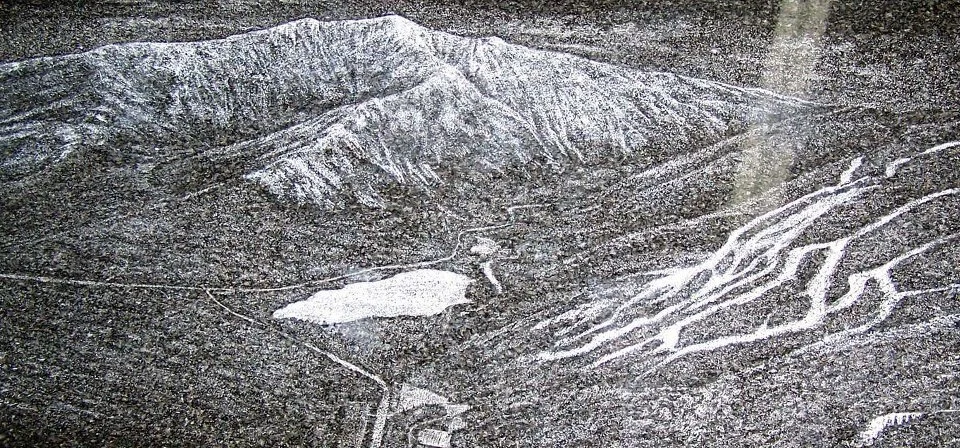 Black and white aerial illustration of mountains with valleys, a lake, and ski slopes.