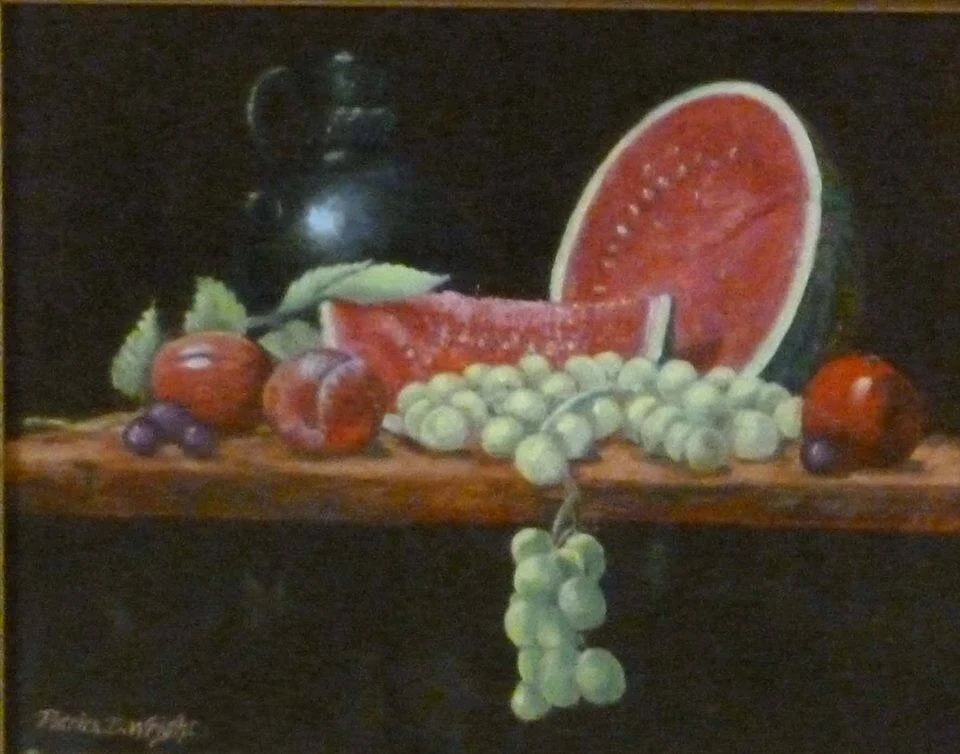 Still life painting with a sliced watermelon, grapes, plums, and an earthenware jug on a wooden surface.