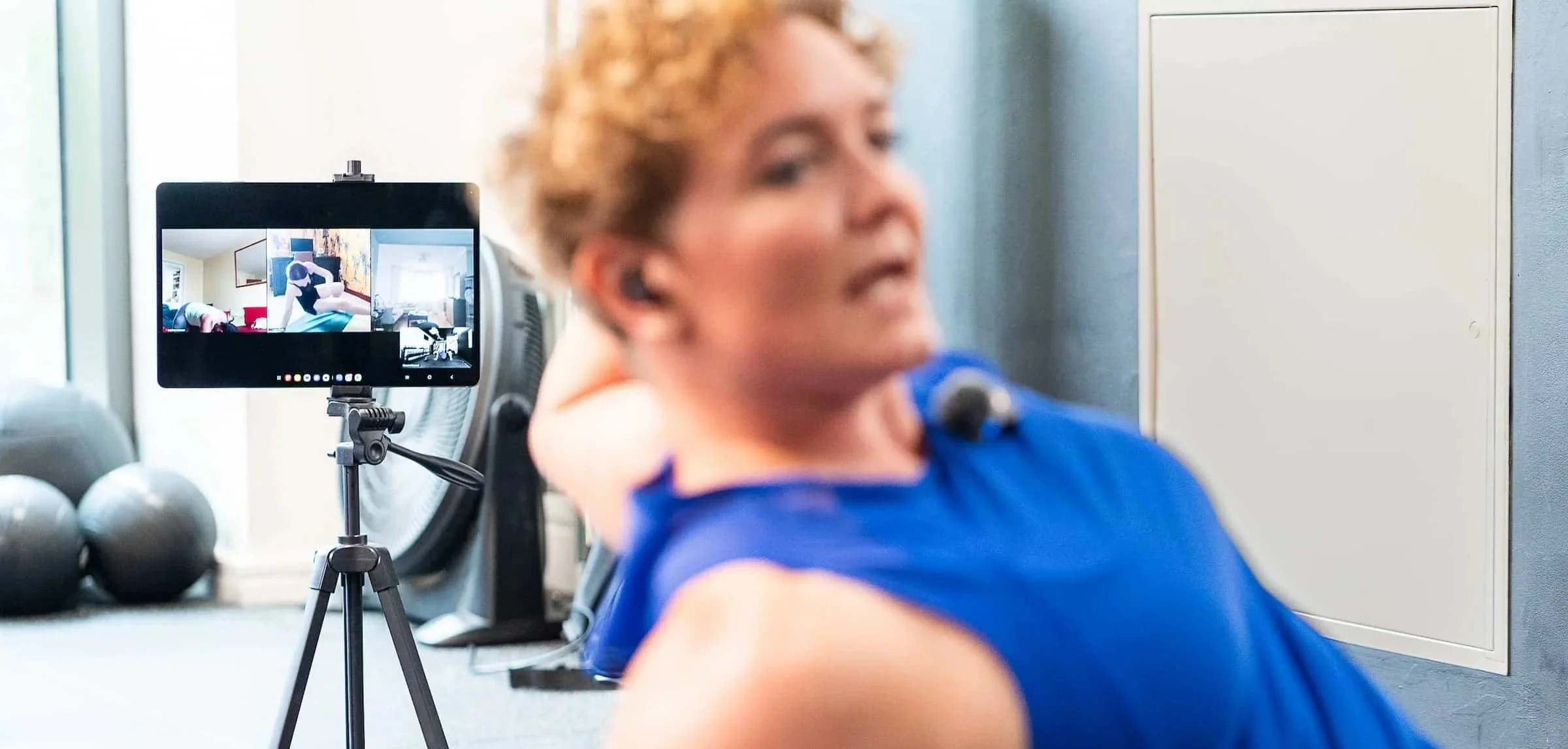 Live online training session in the studio, with an ipad on a tripod showing clients following along to Rowena online