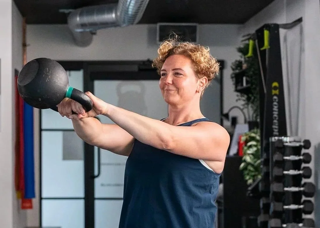 photo of Rowena Ramsell training in the studio with a kettlebell