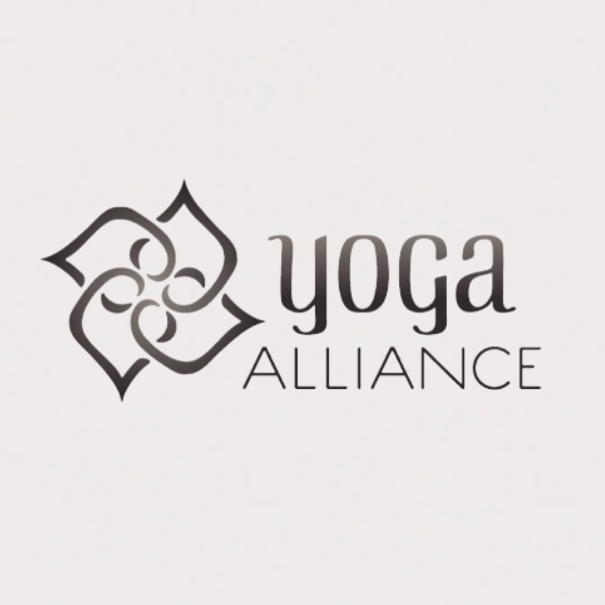 Logo of Yoga Alliance with a decorative floral design and the words 'yoga ALLIANCE' in stylized text.