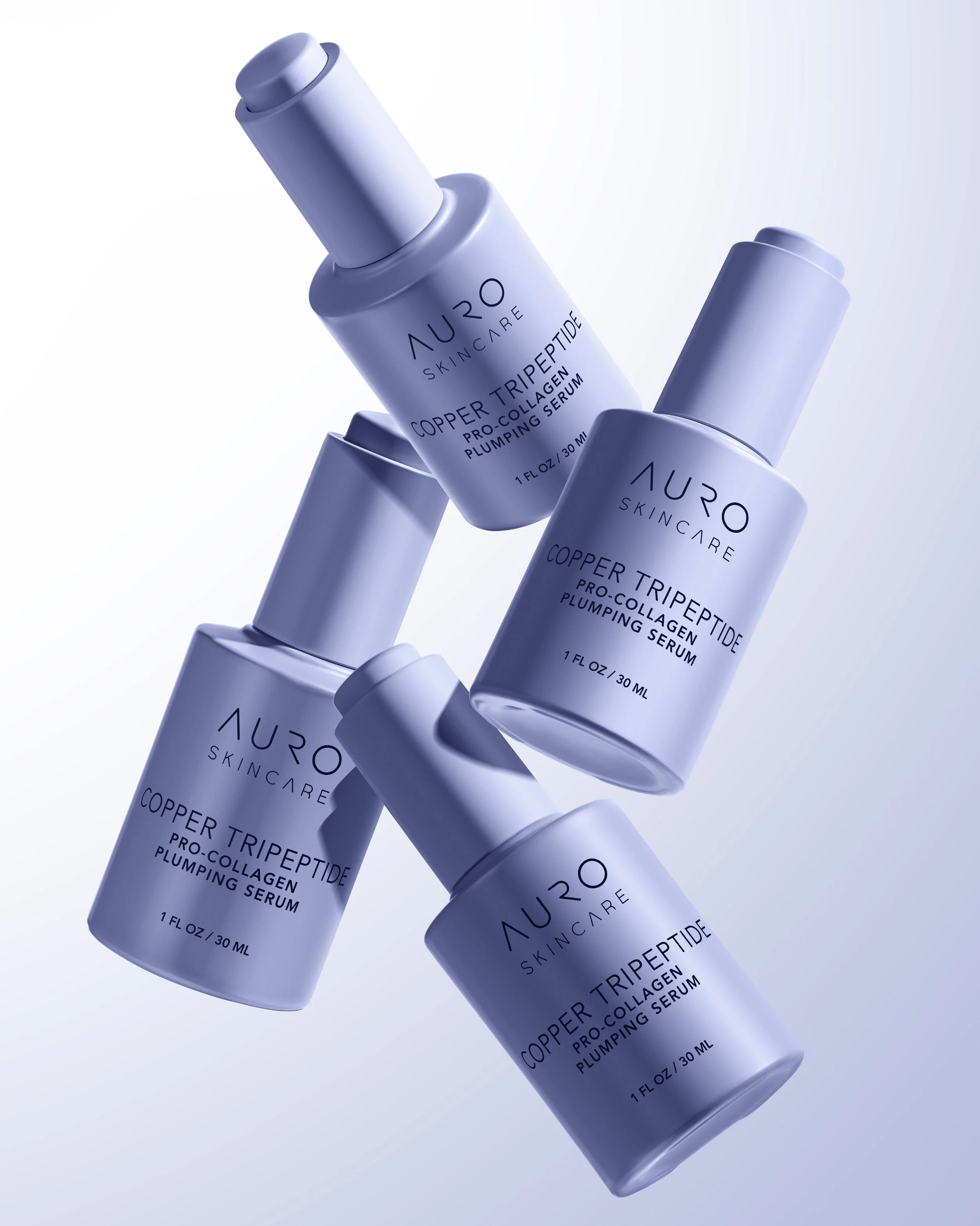 Commercial skincare product photography featuring blue bottles arranged in a studio setting.